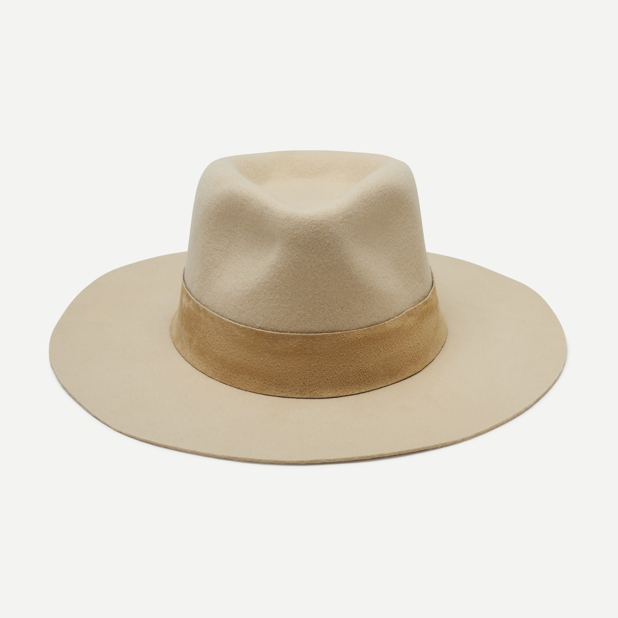 Beige fedora hat with a wide brim on a white background