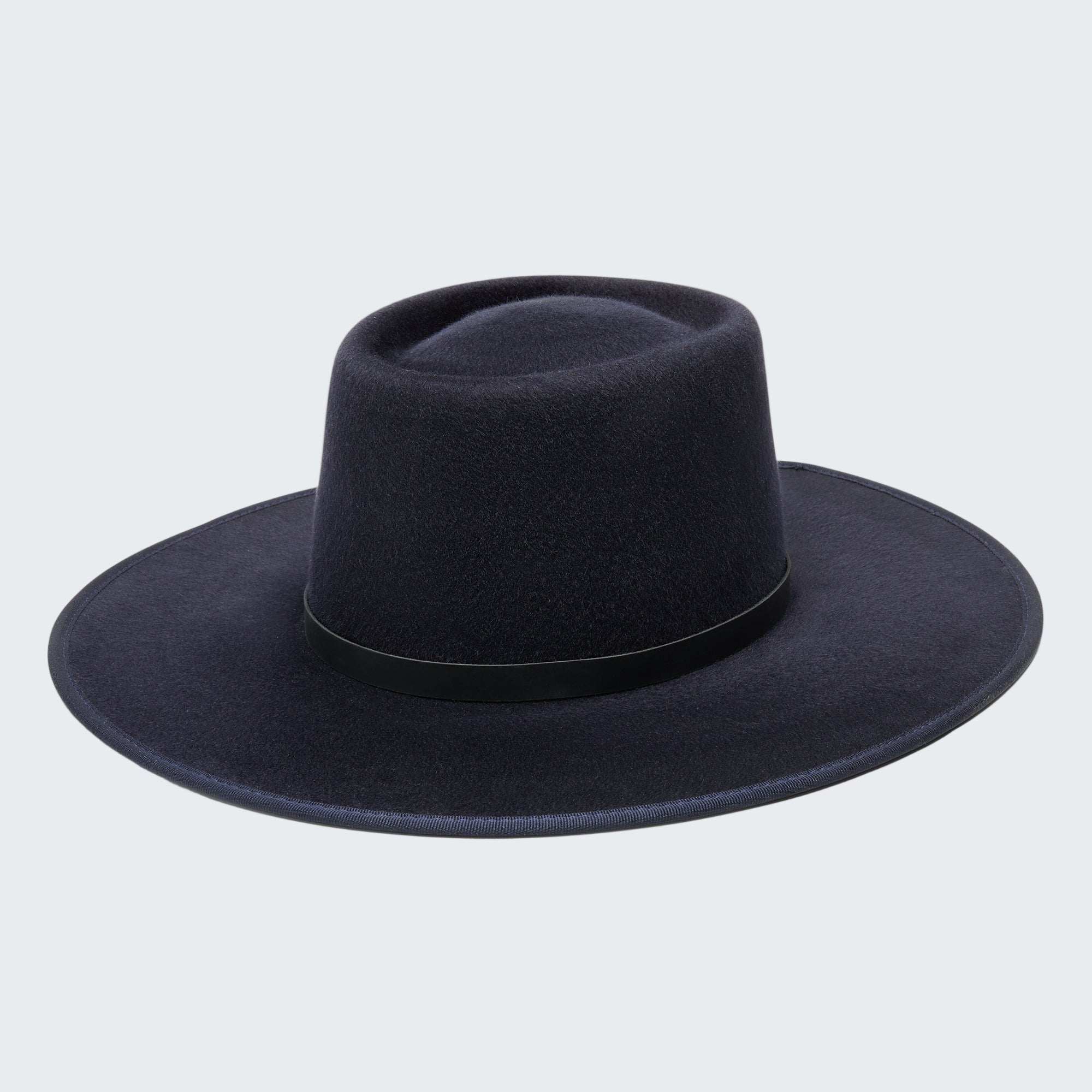 Navy blue fedora hat on a white background