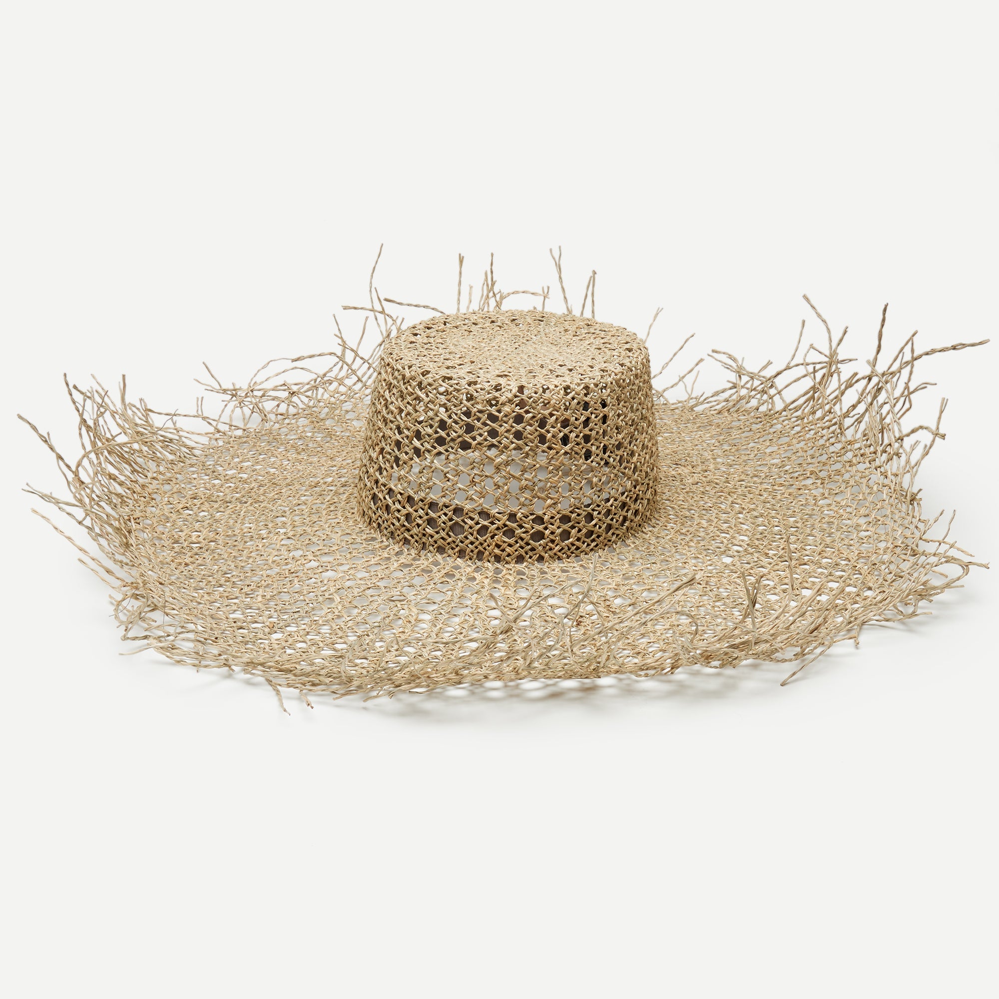 Beige straw hat with wide brim on a white background