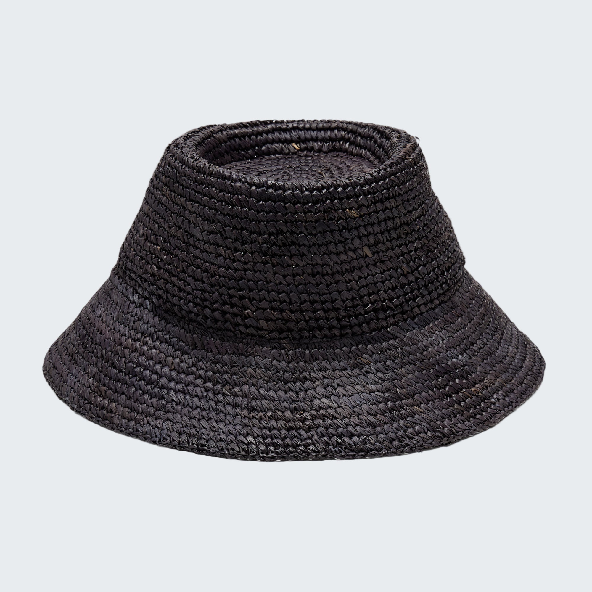 Black woven bucket hat on a light gray background