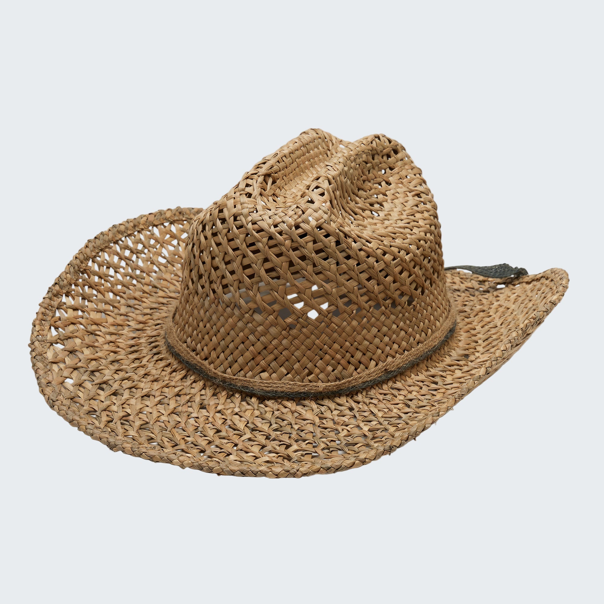 Woven straw cowboy hat on a white background