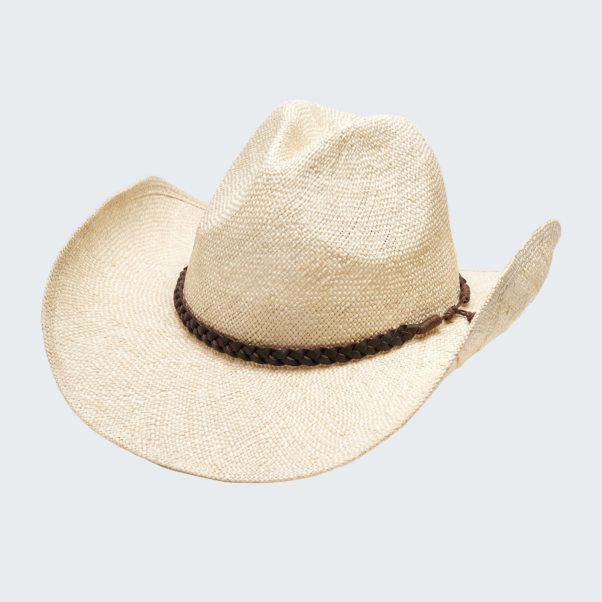 Beige straw cowboy hat with a braided brown band on a white background