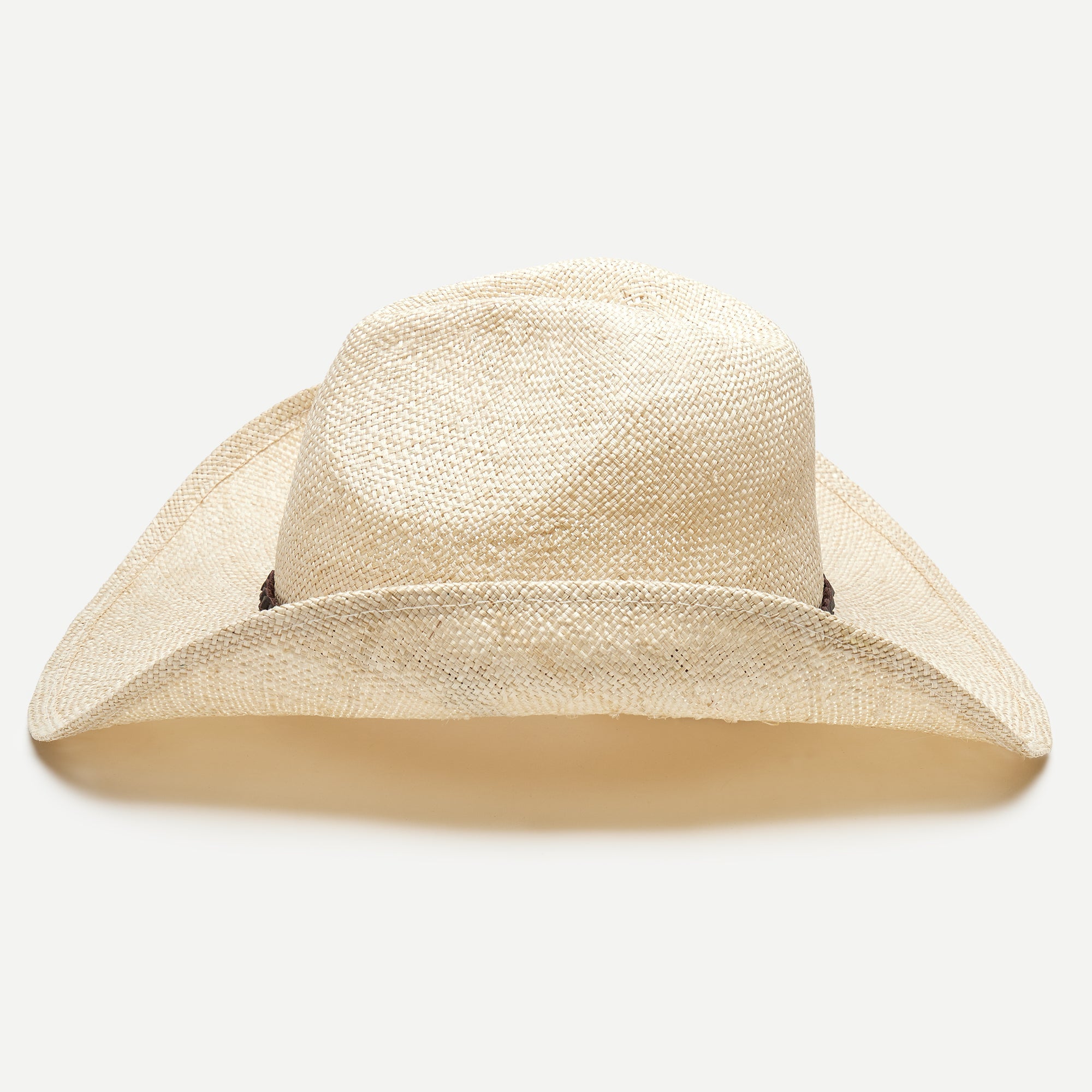 Beige straw hat on a light gray background