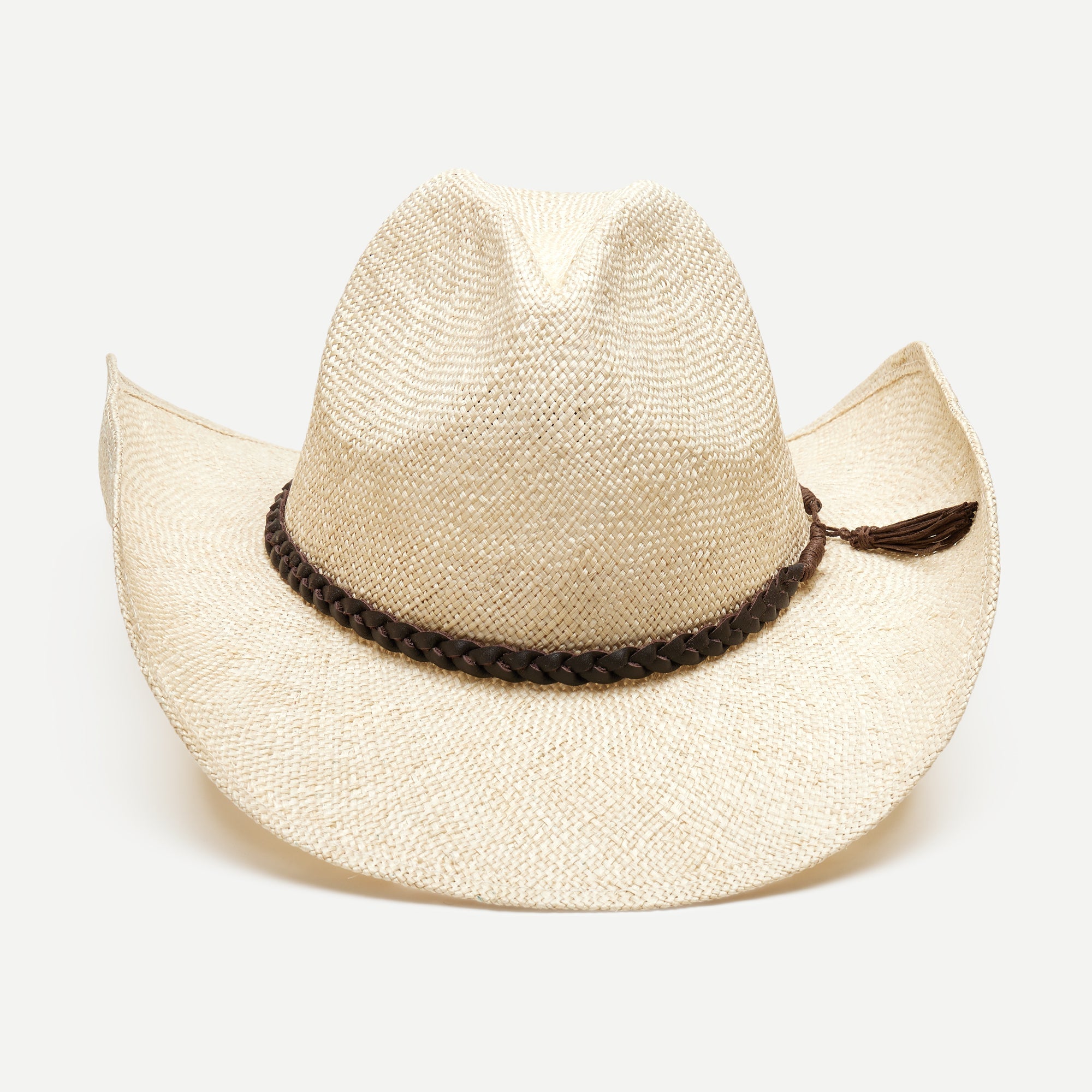 Beige straw cowboy hat with a braided brown band on a white background