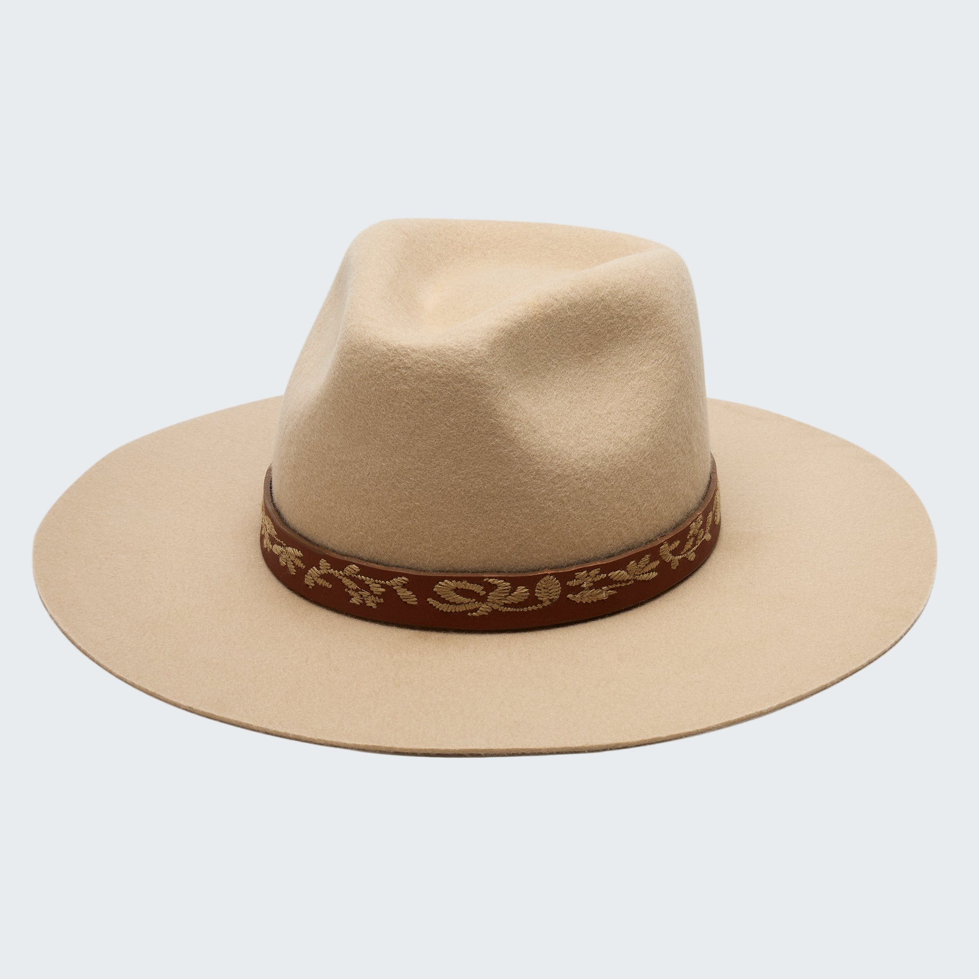 Beige fedora hat with a decorative brown band on a white background