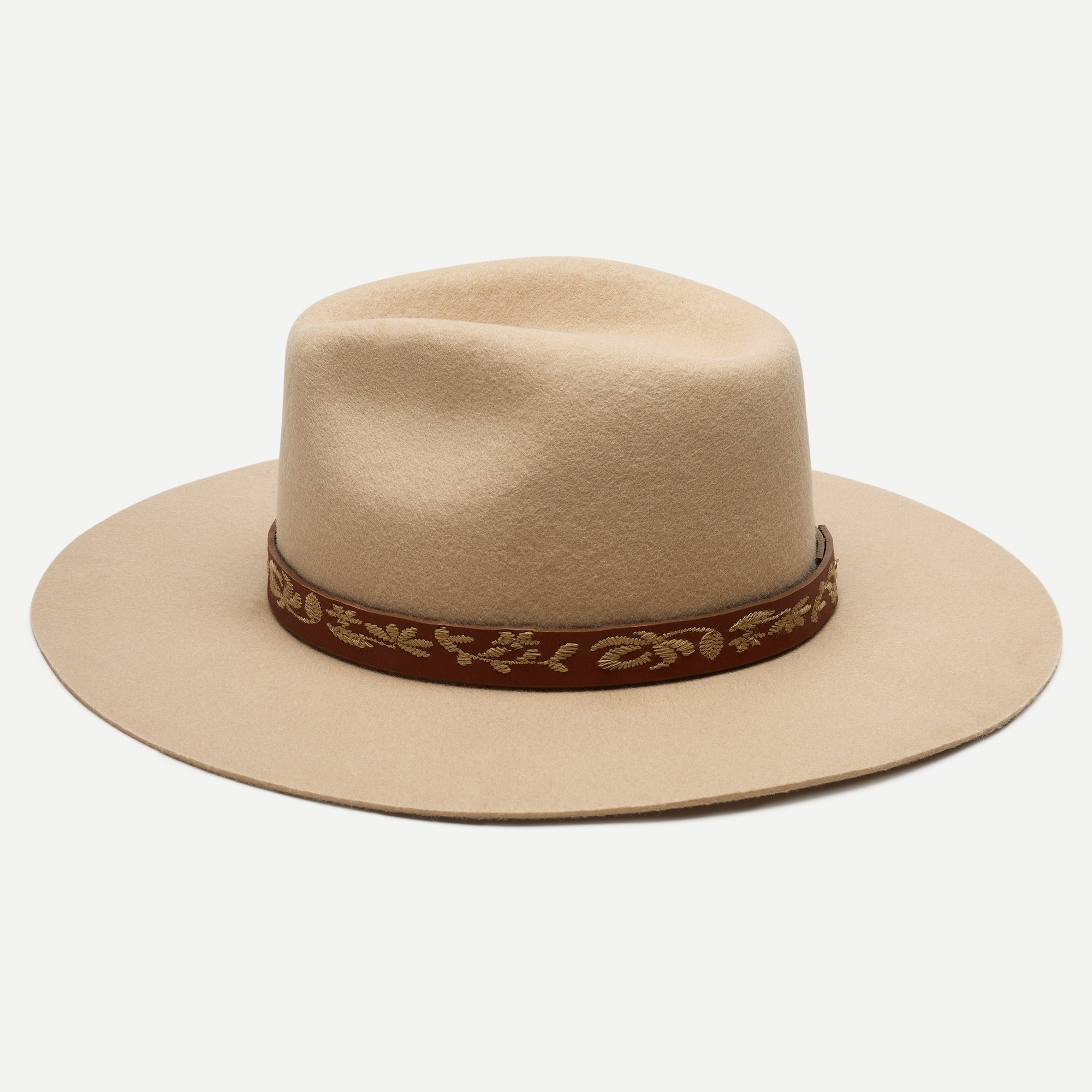 Beige hat with a brown band featuring gold detailing on a white background
