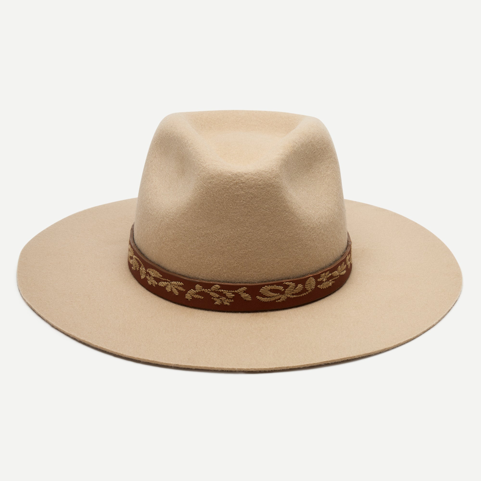 Beige hat with a brown band on a white background