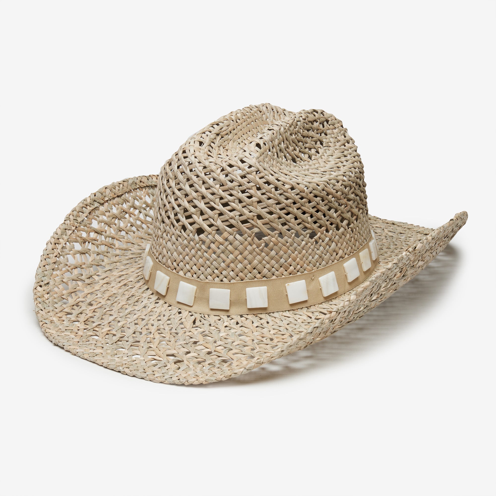 Straw hat with a decorative band on a white background