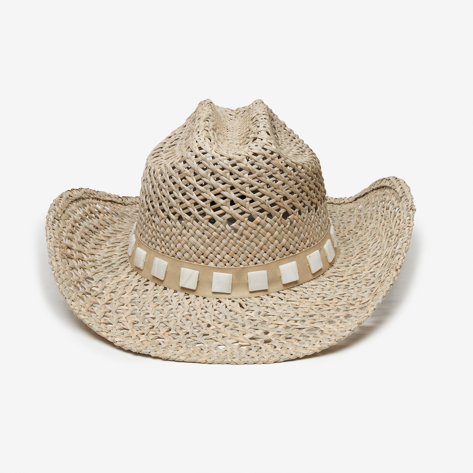 Beige straw cowboy hat with a band on a white background