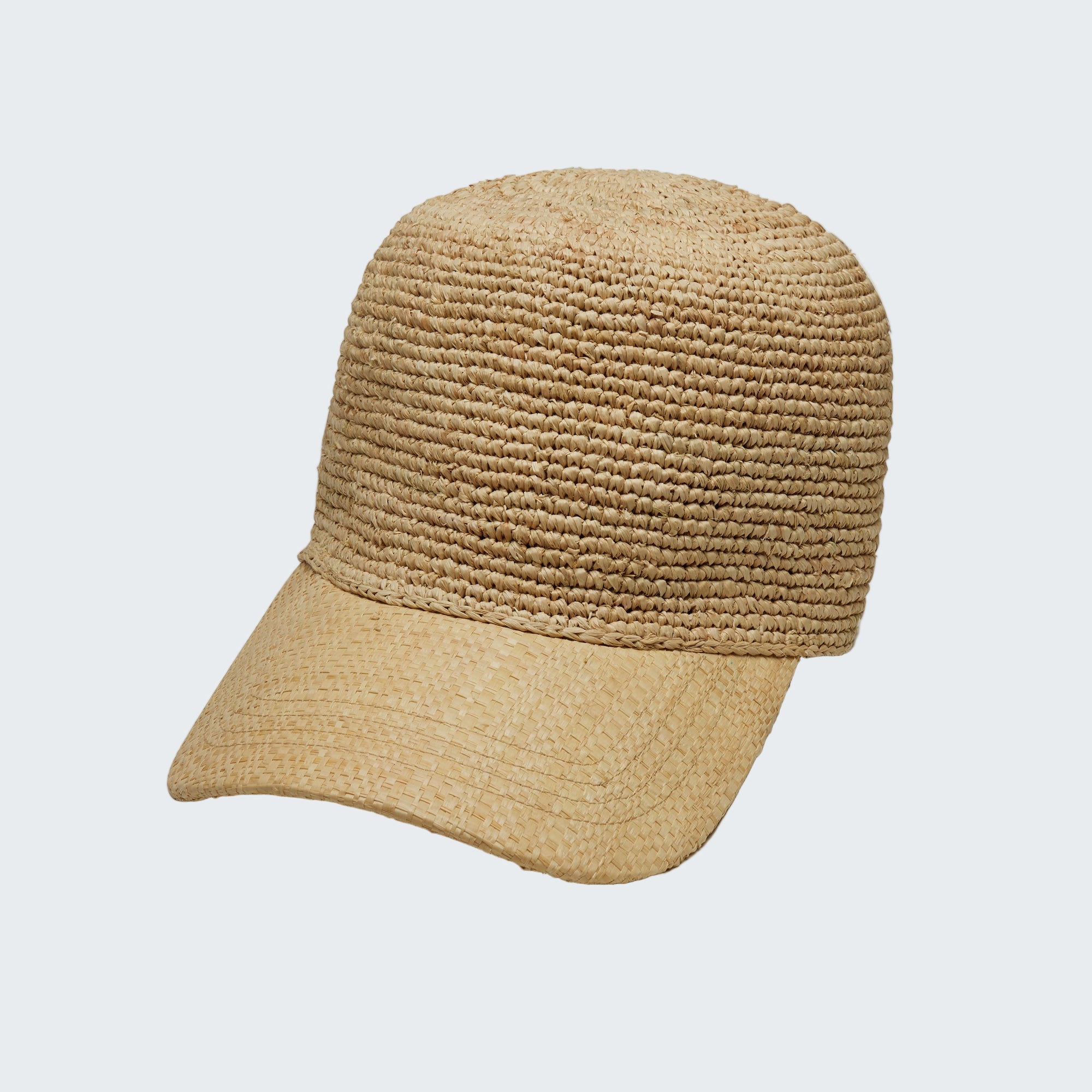 Beige straw cap on a light gray background