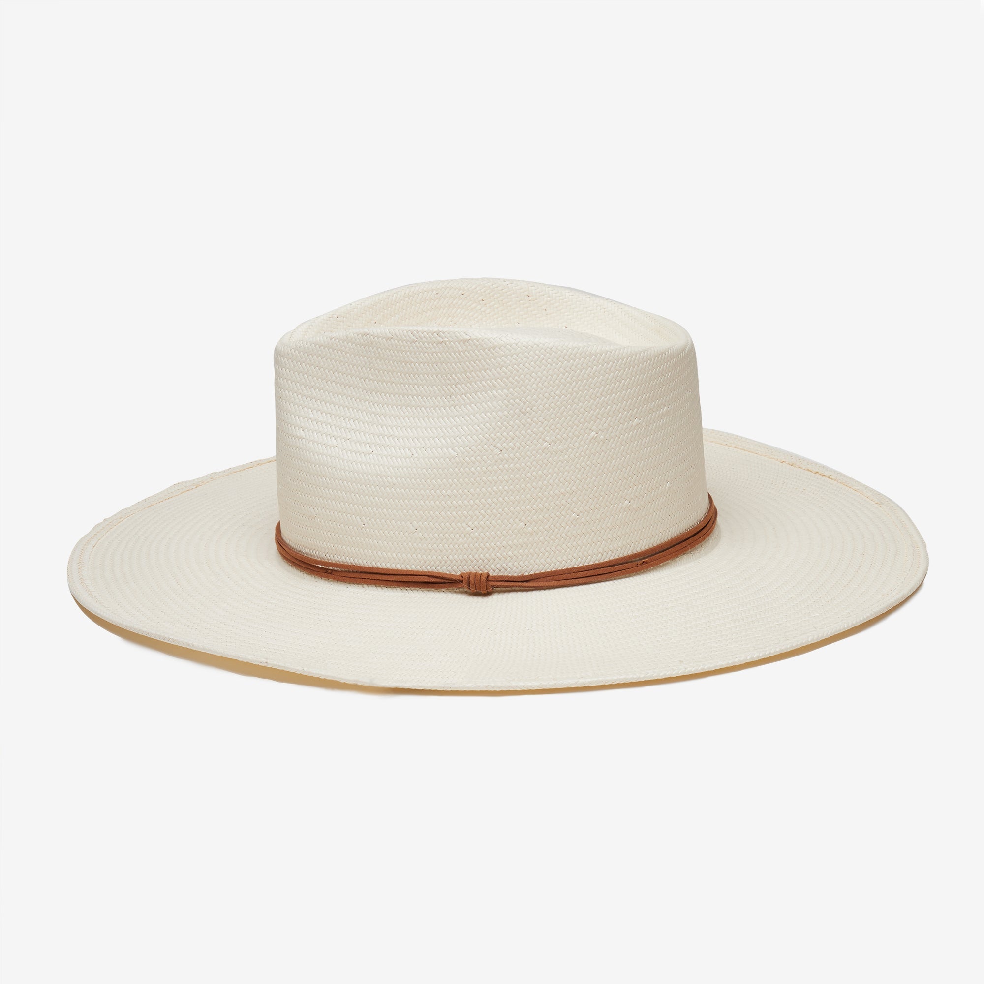 White straw hat with a brown band on a white background