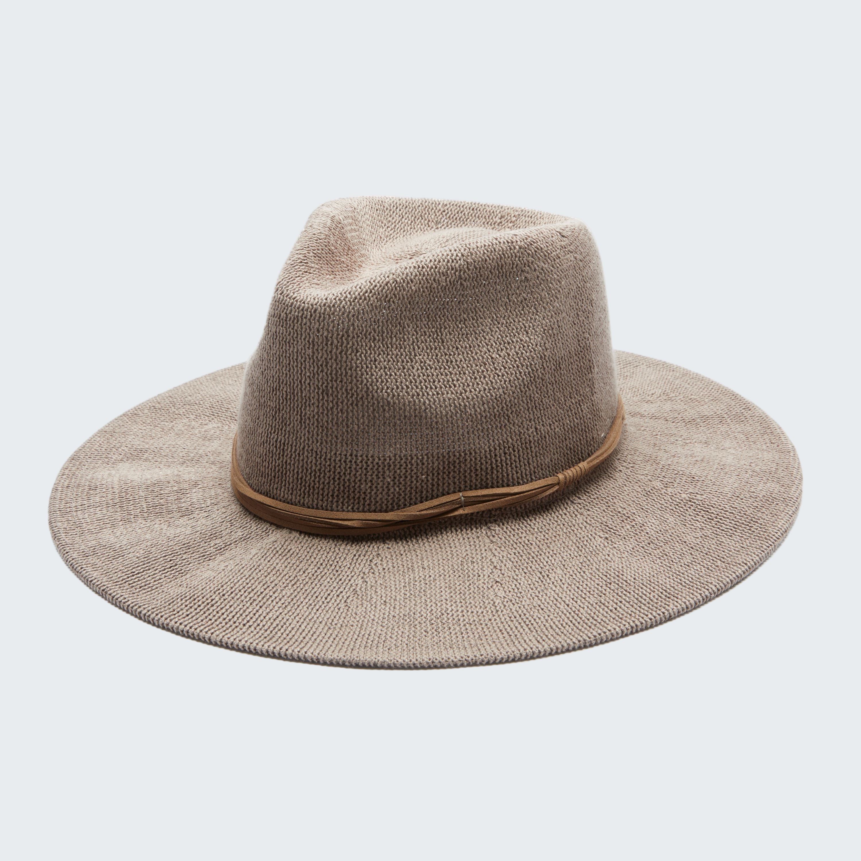 Beige fedora hat on a white background