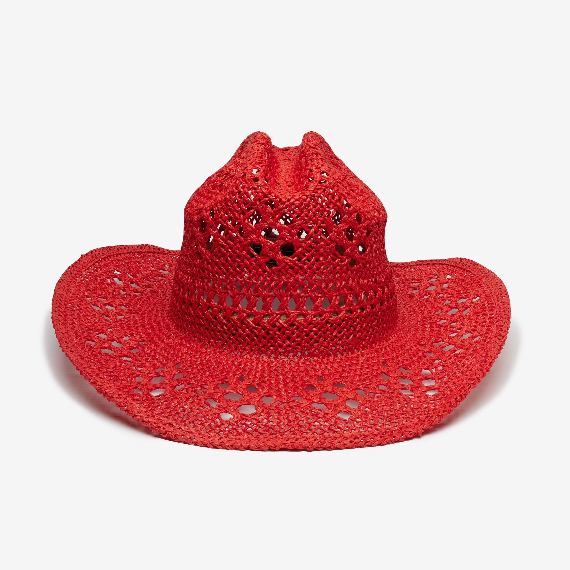 Red straw hat with a wide brim on a white background