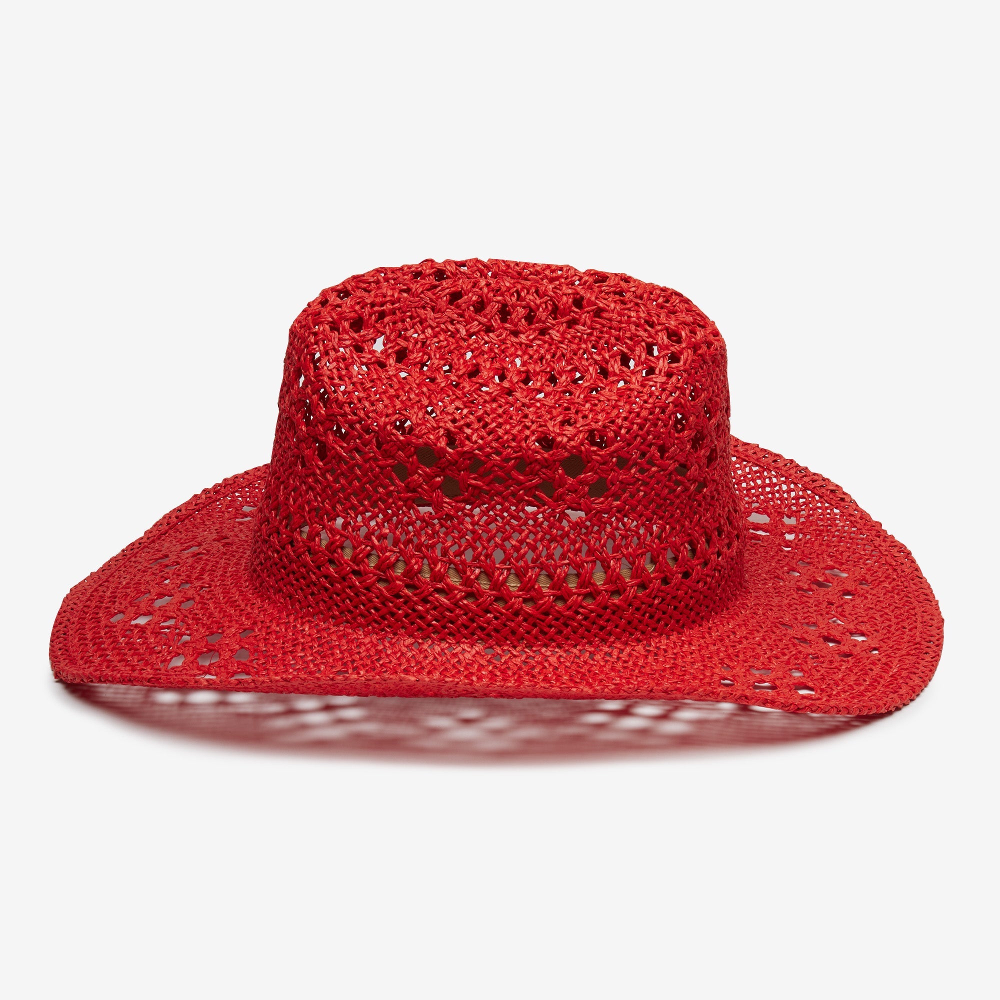 Red straw hat on a white background