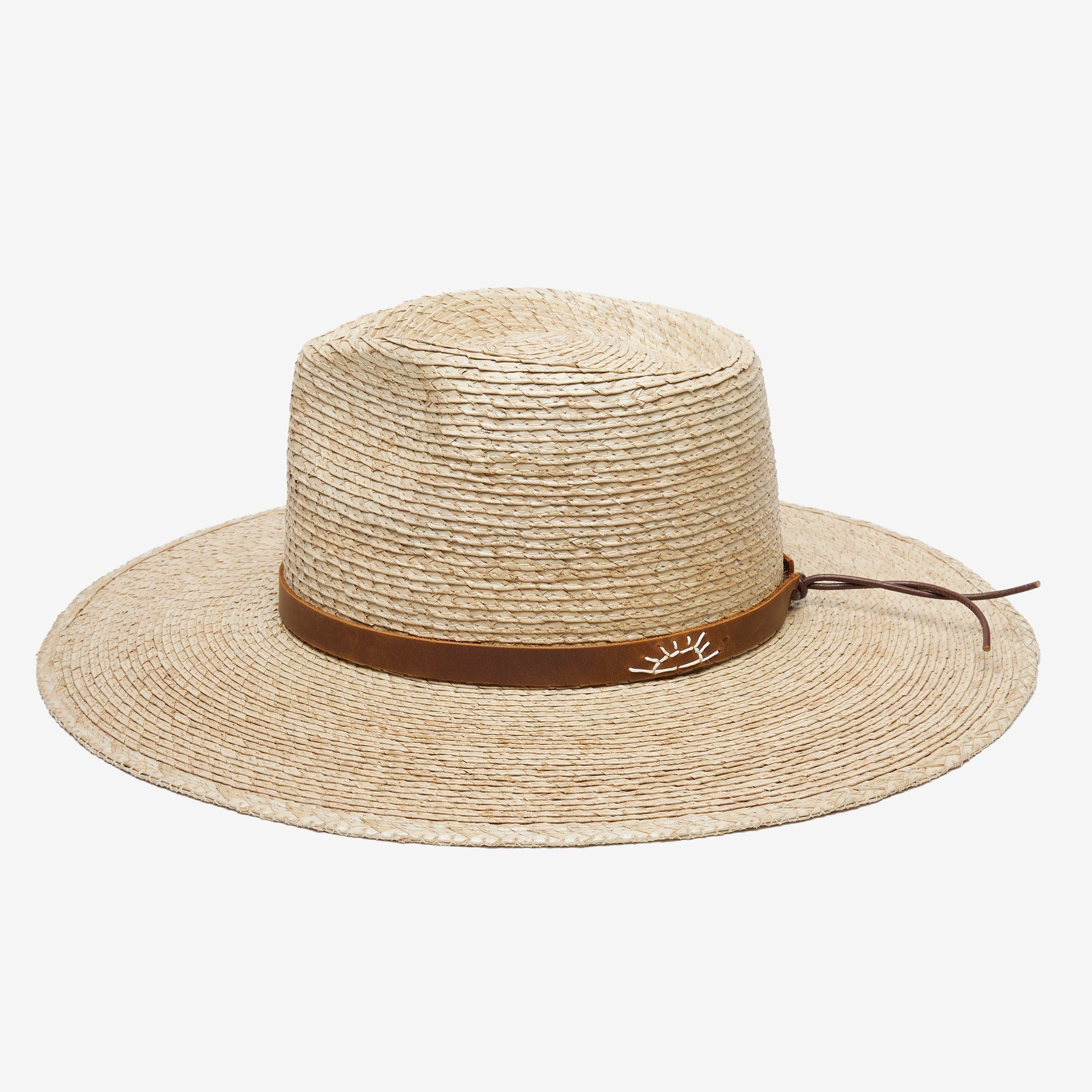 Beige straw hat with a brown band on a white background