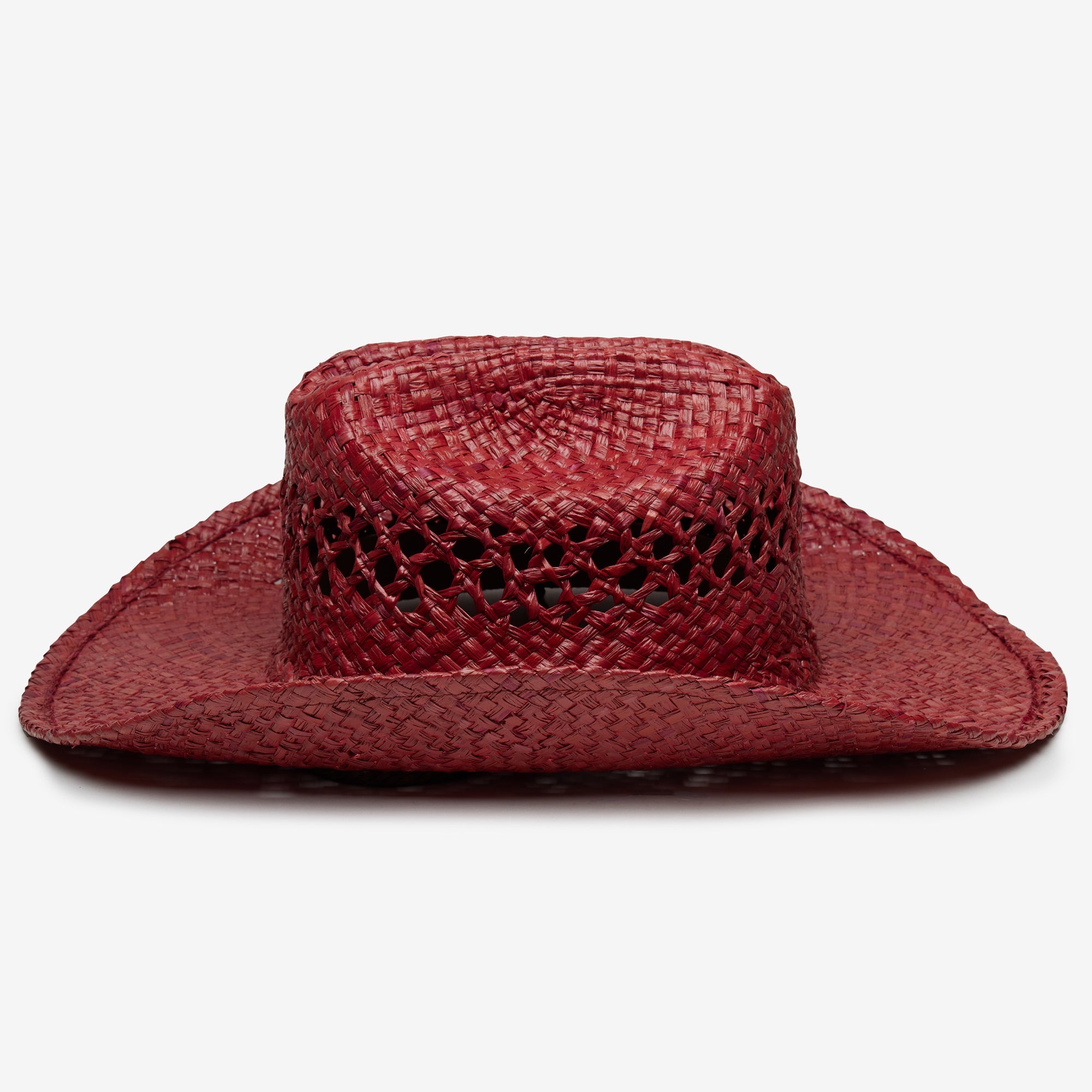 Red straw cowboy hat on a white background