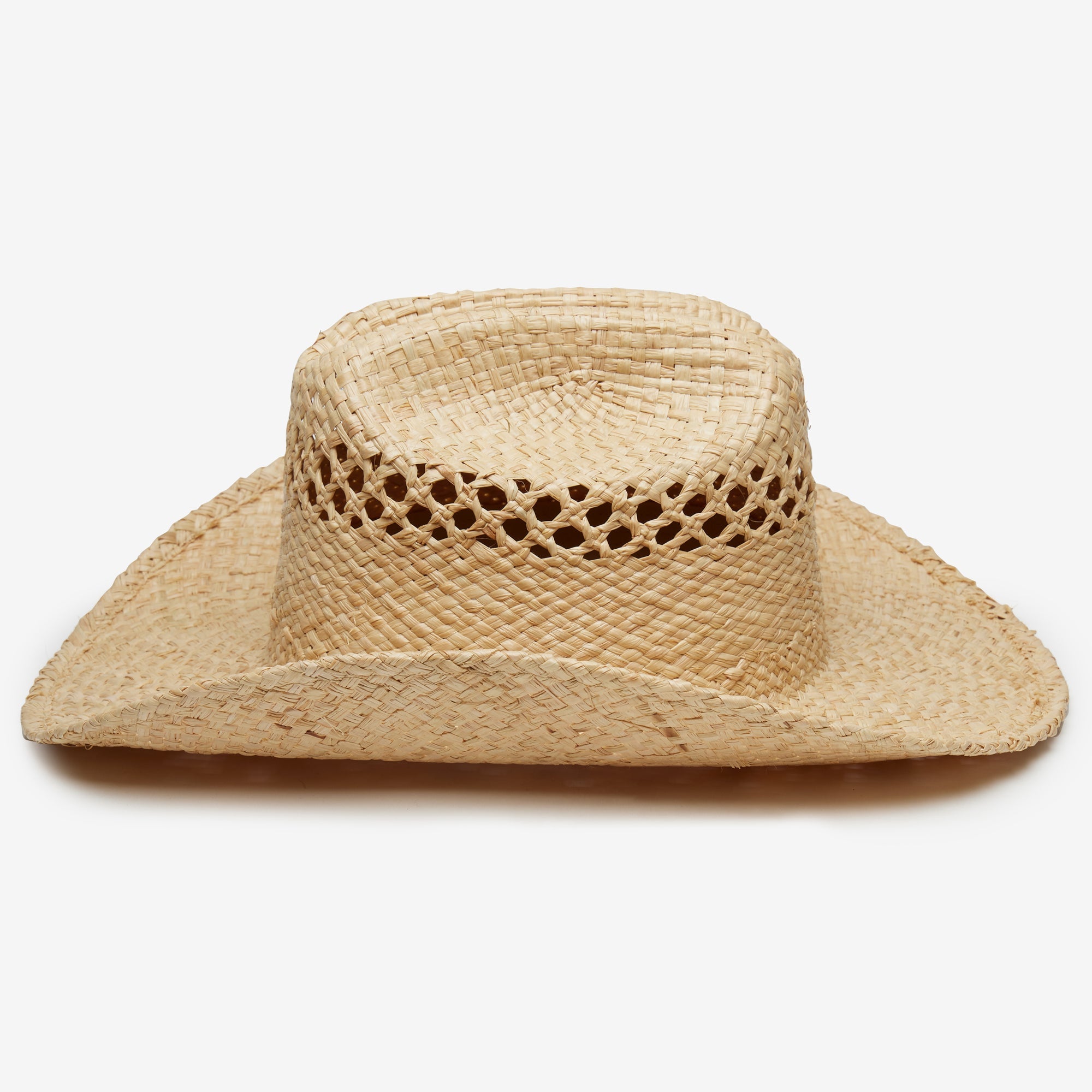 Straw cowboy hat with a decorative center on a white background