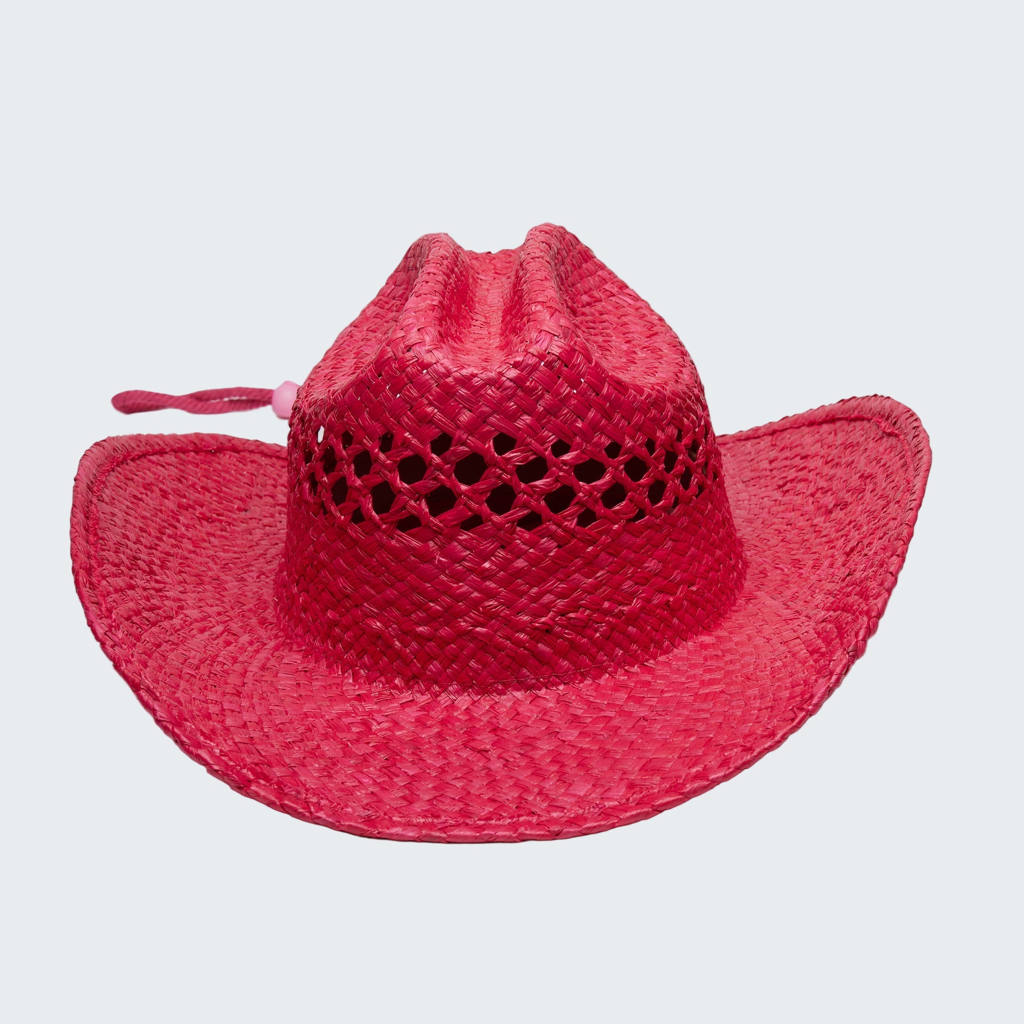 Red straw hat with a wide brim on a white background
