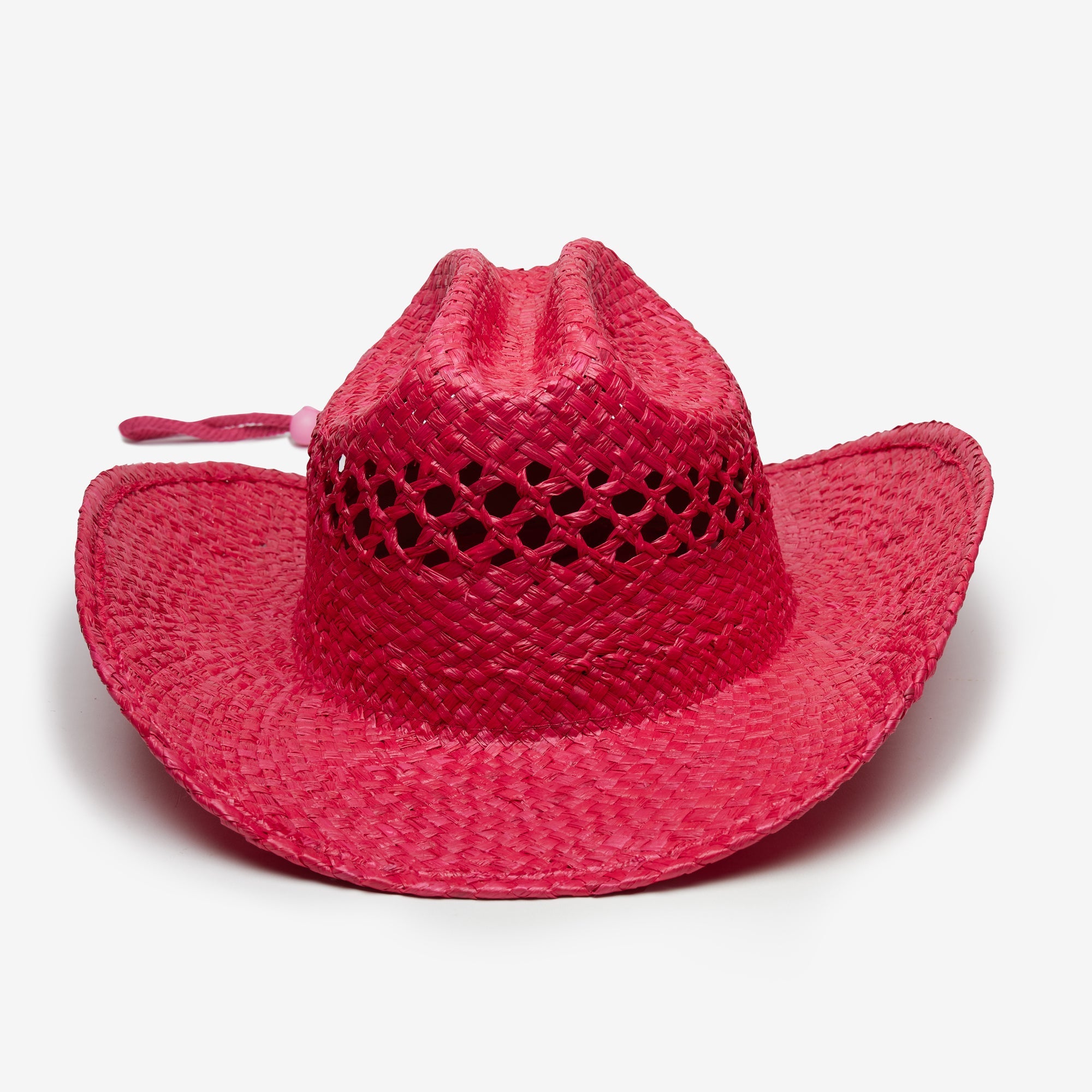 Red straw hat with a wide brim on a white background