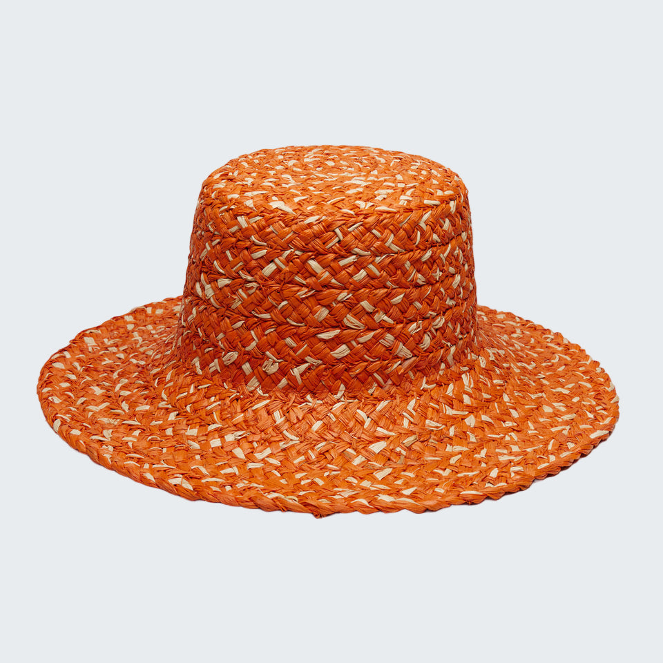 Orange woven hat on a white background