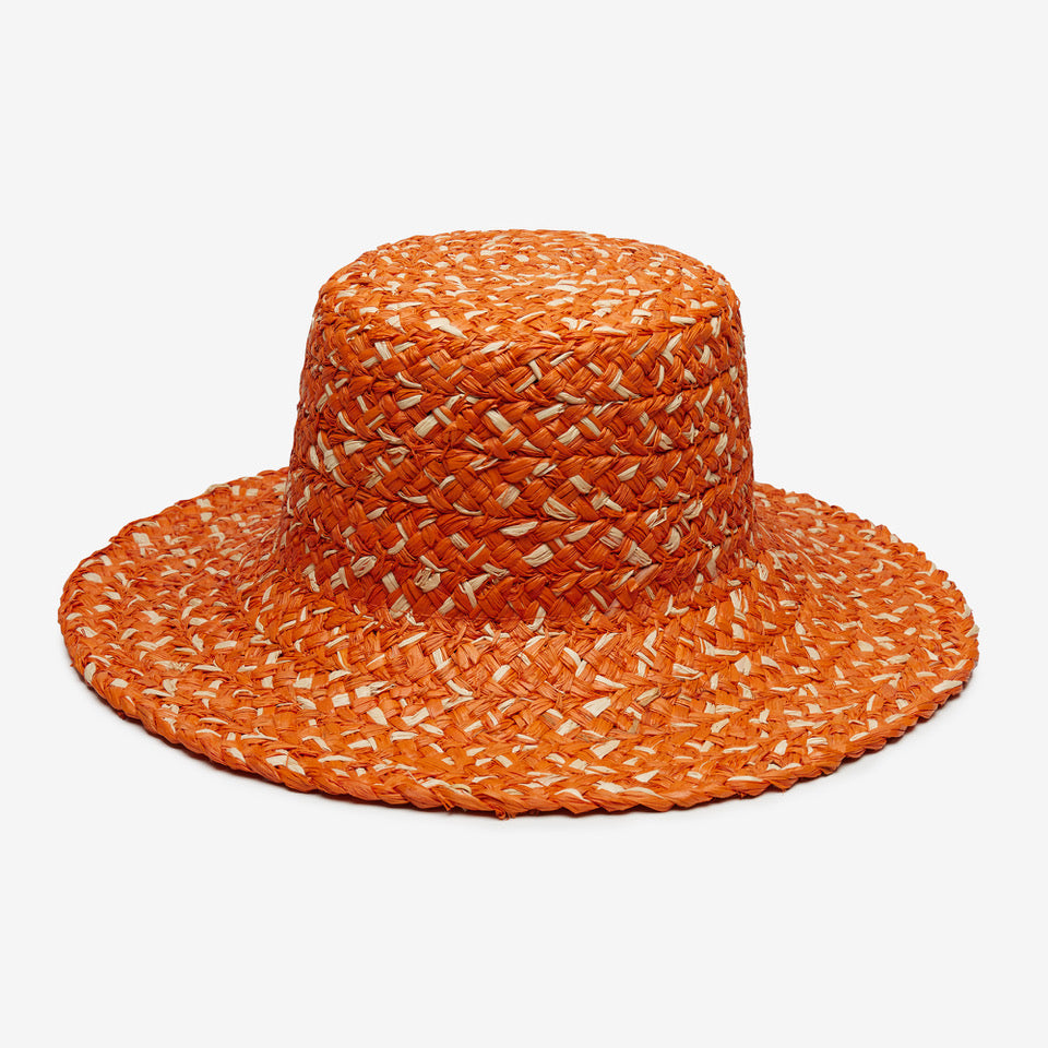 Orange woven hat on a white background