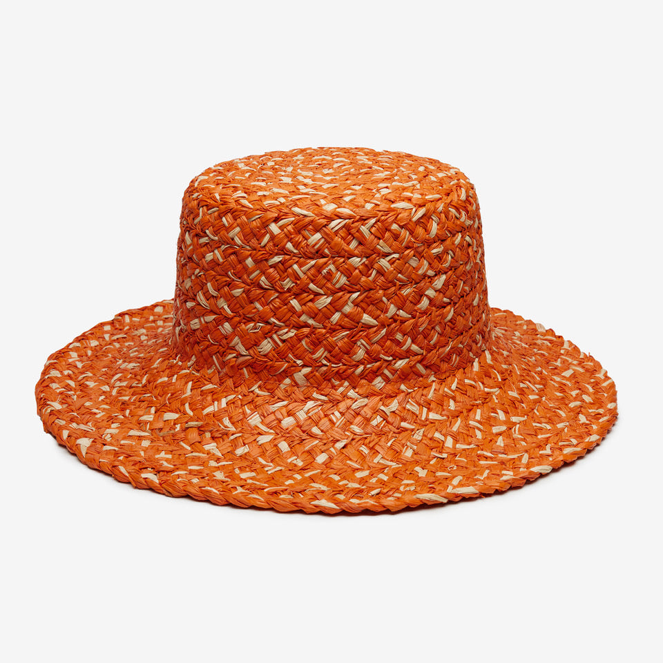 Orange woven hat on a white background