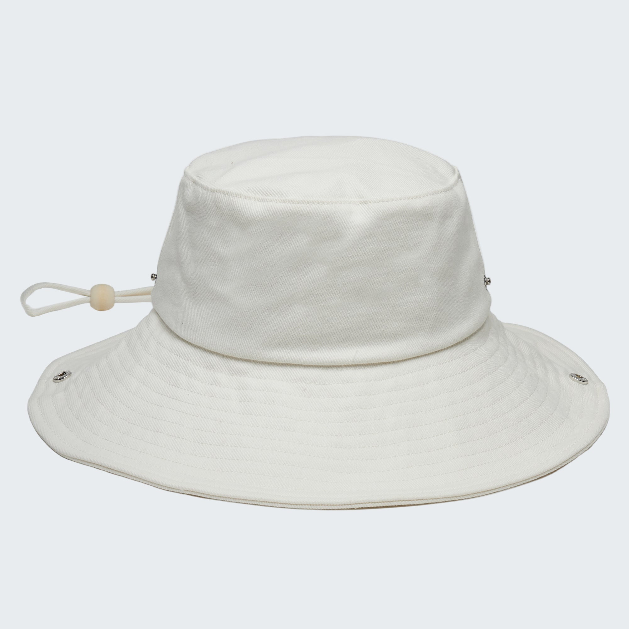 White bucket hat with a strap on a white background