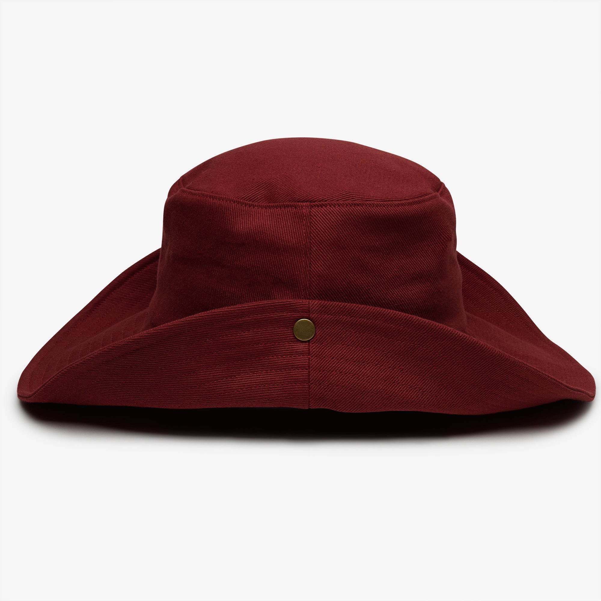 Maroon bucket hat with a button on a white background