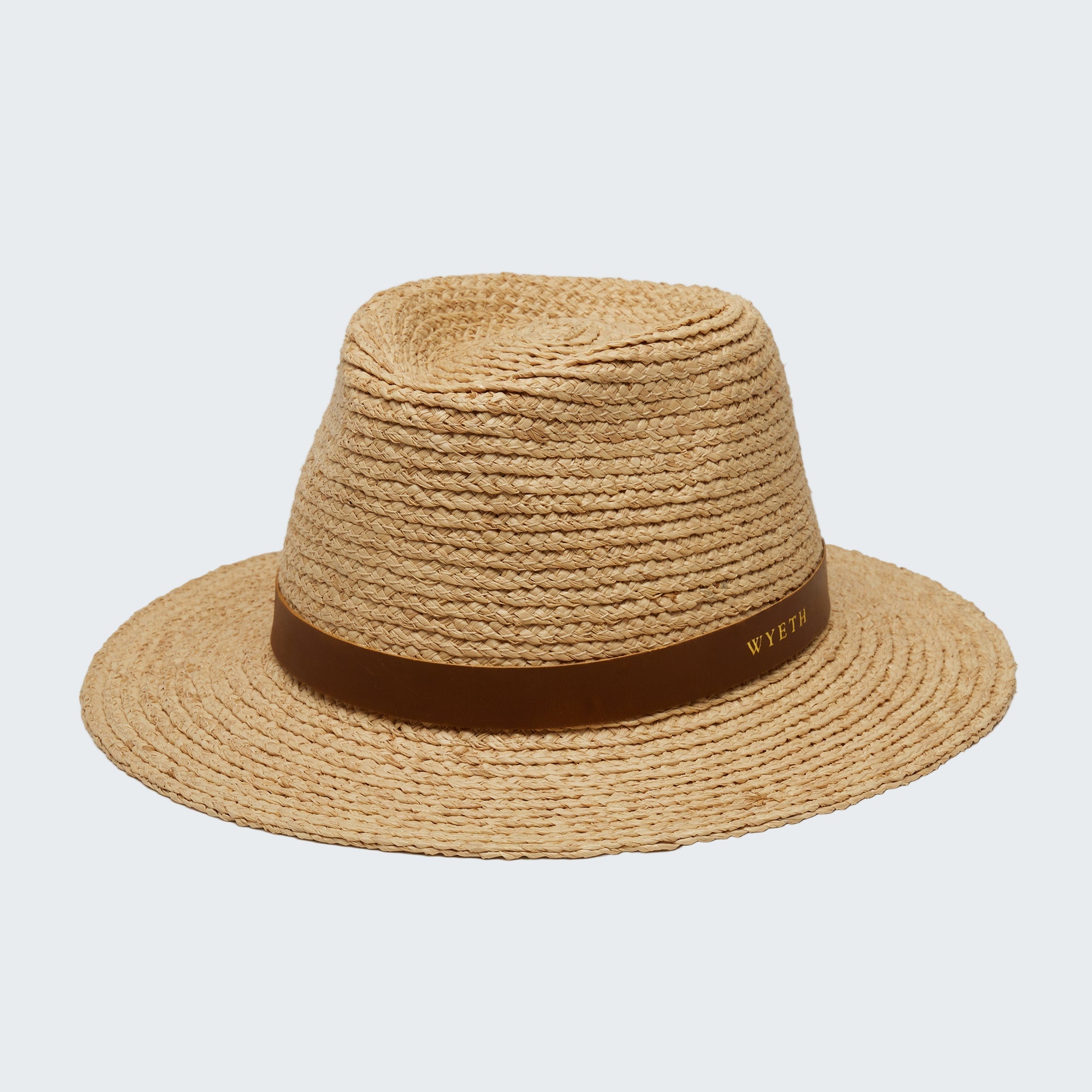 Beige straw hat with a brown band on a white background