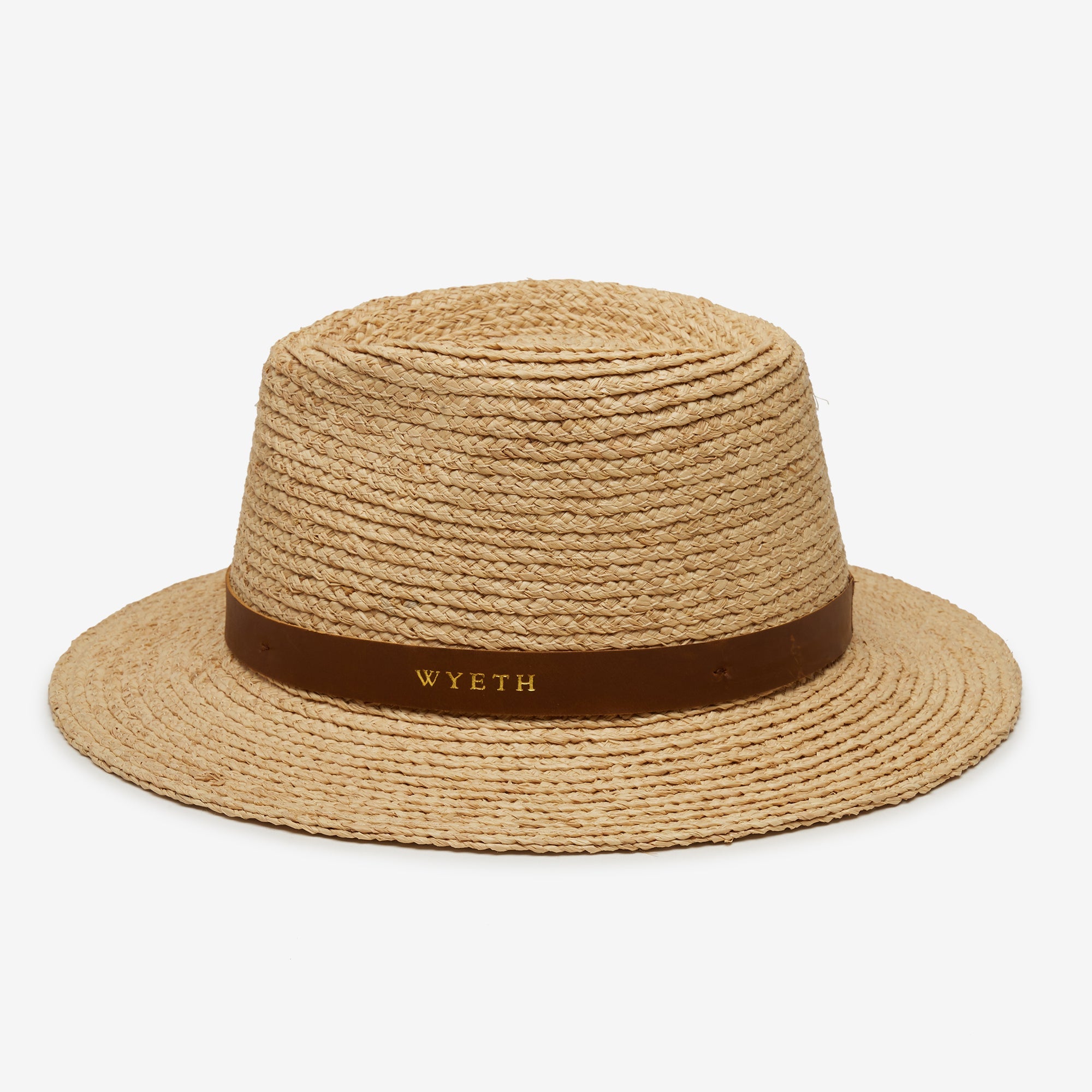 Beige straw hat with a brown band featuring 'Wyeth' branding on a white background