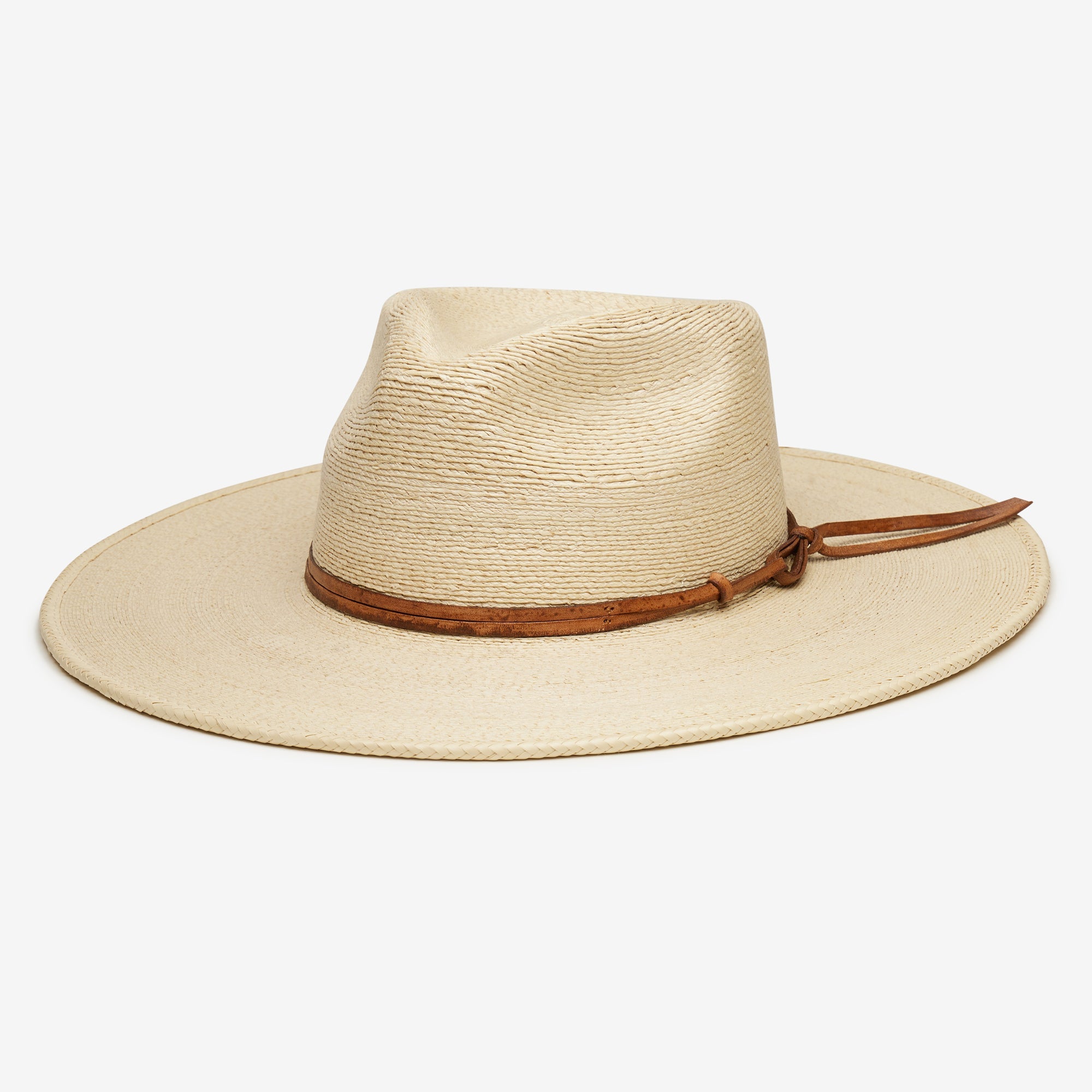 Beige straw hat with a brown leather band on a white background