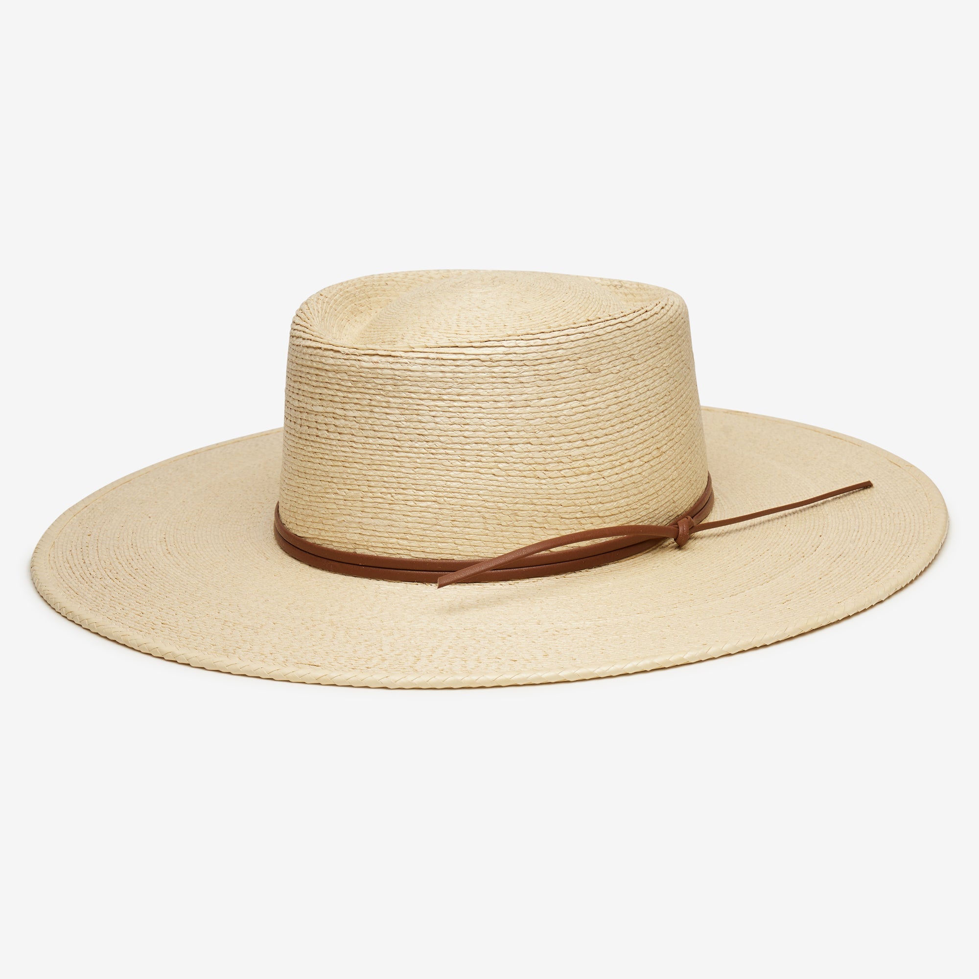 Beige straw hat with a brown band on a white background