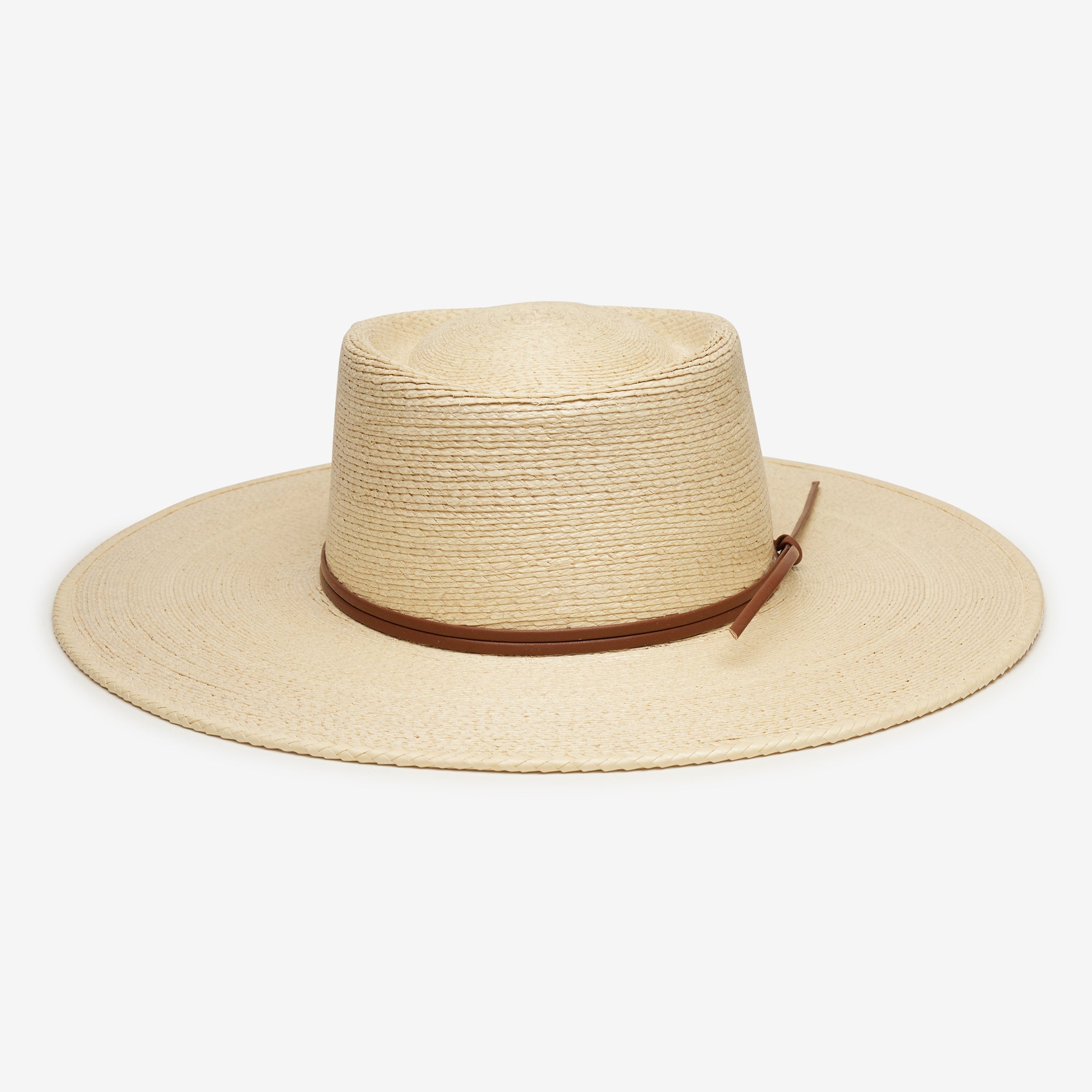 Beige straw hat with brown band on a white background