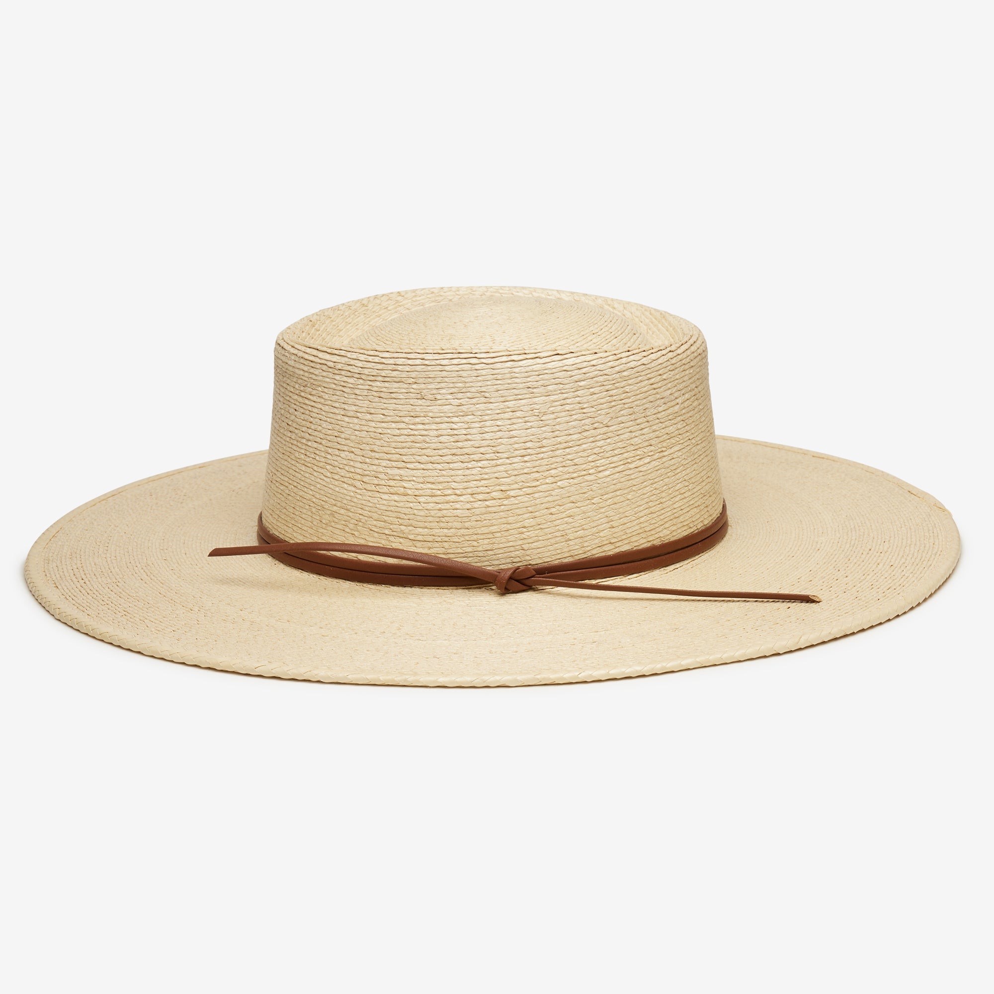 Beige straw hat with a brown band on a white background
