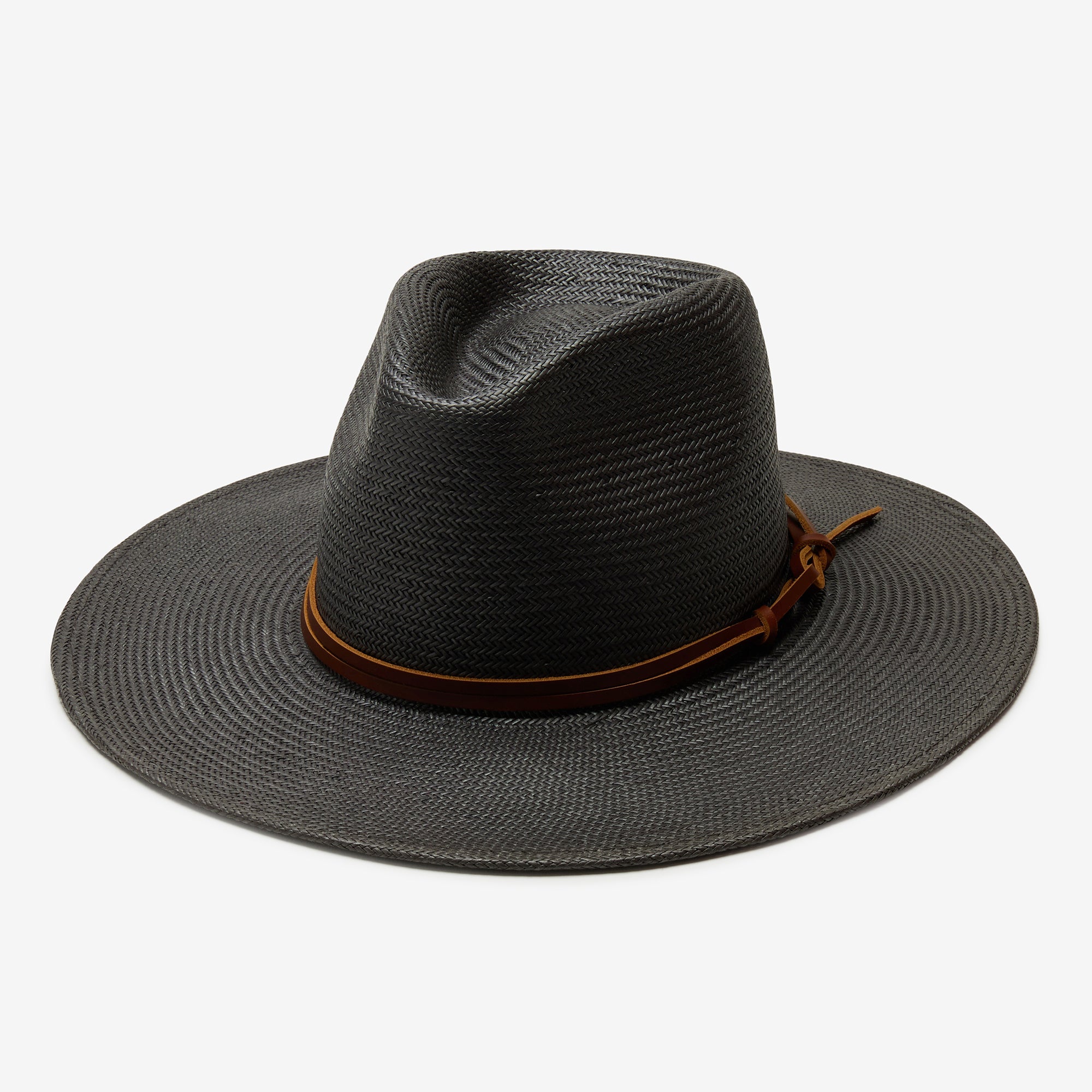 Black straw hat with a brown band on a white background