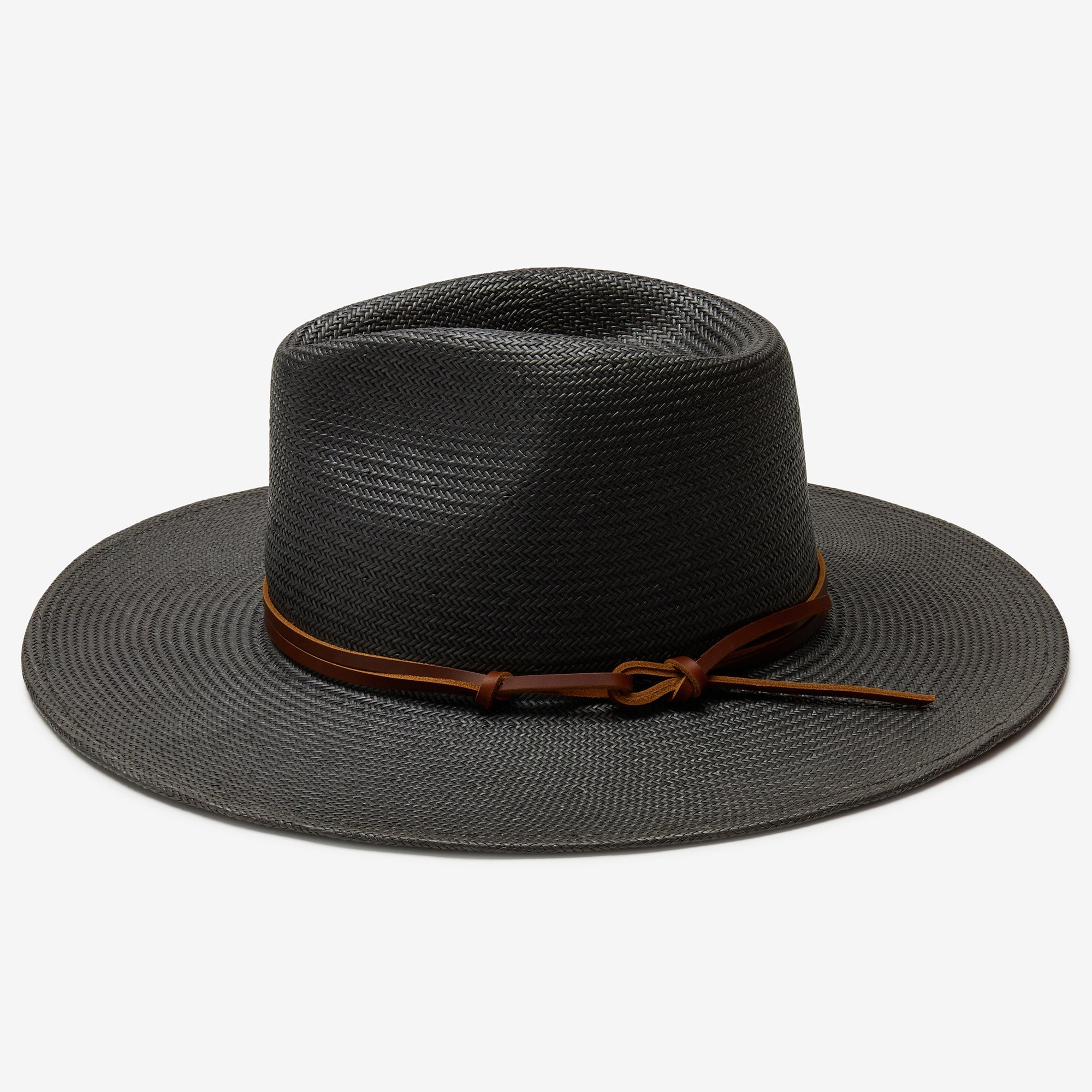 Black straw hat with a brown band on a white background