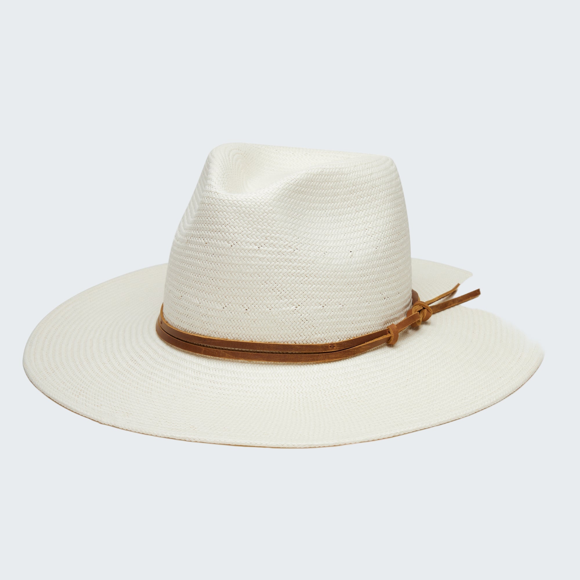 White straw hat with a brown band on a white background