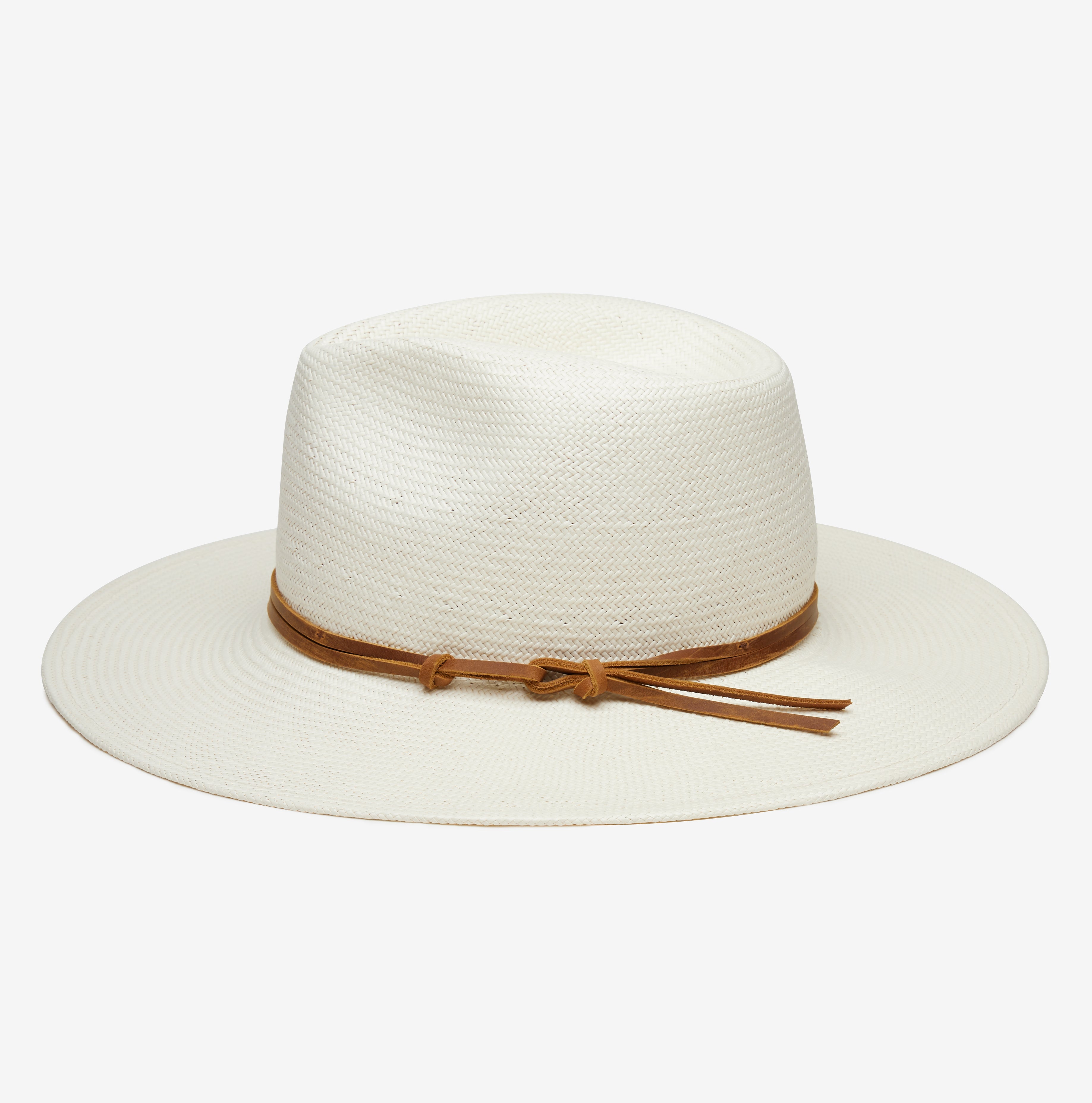 White straw hat with a brown band on a white background
