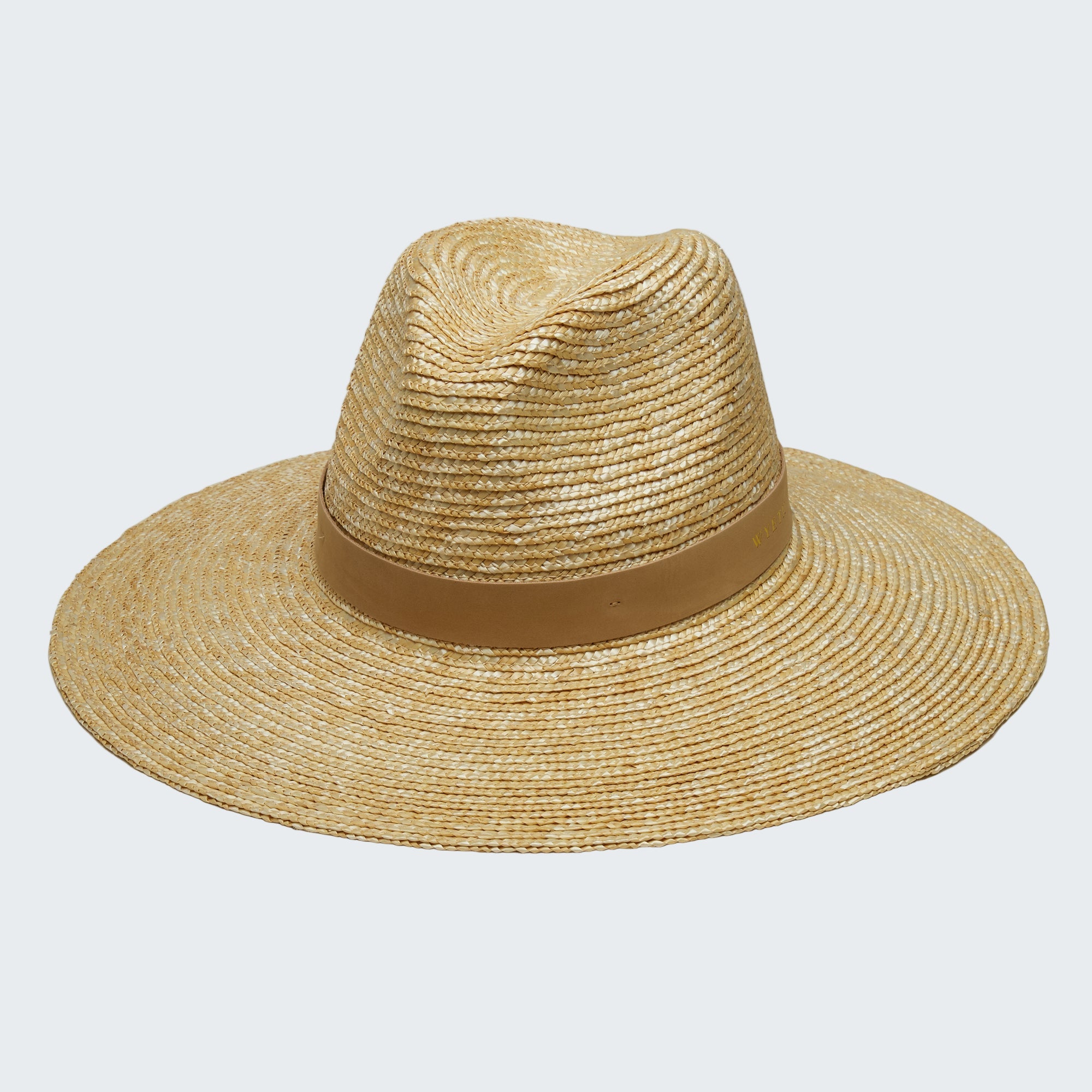 Beige straw hat with a brown band on a white background
