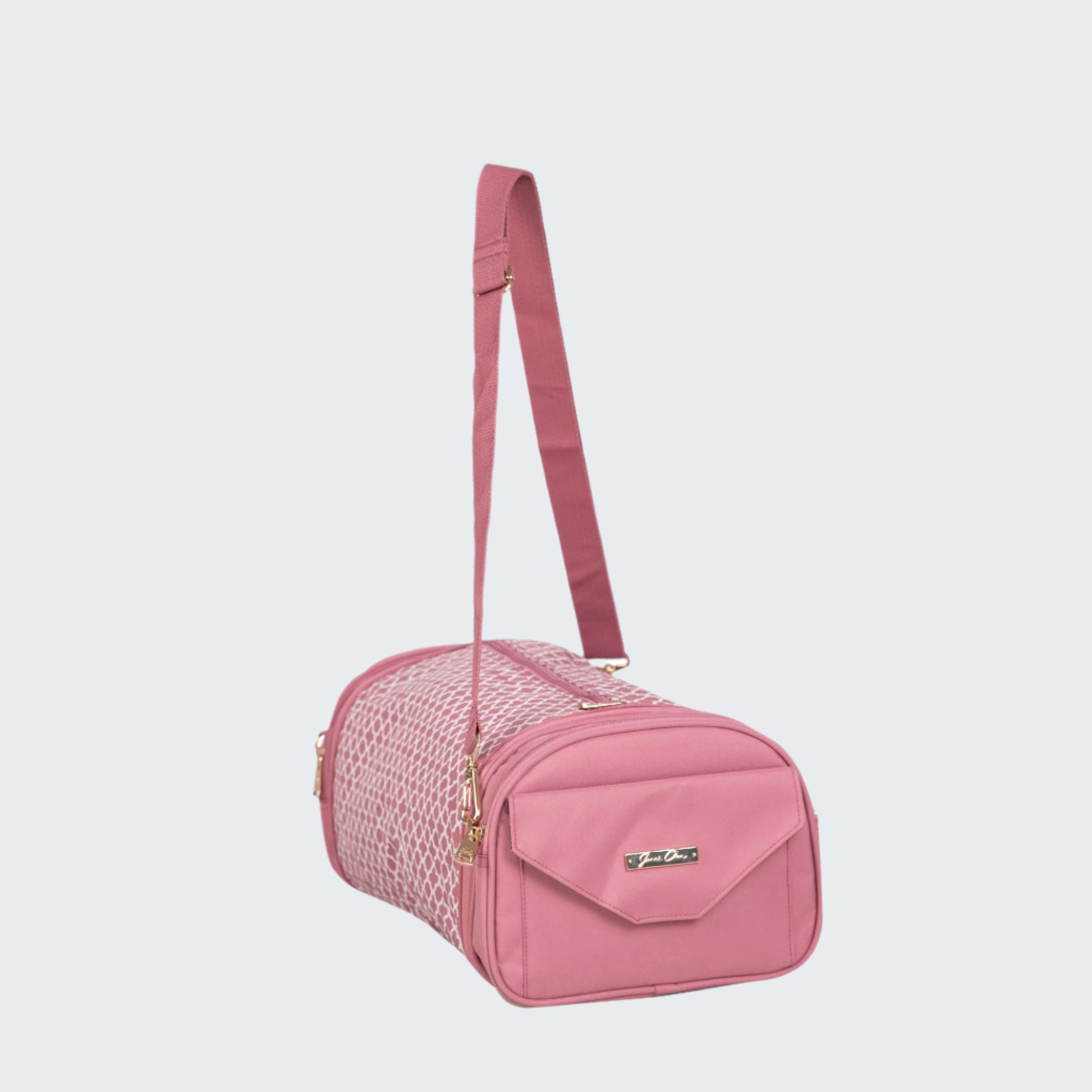 Pink pet carrier with a strap on a white background