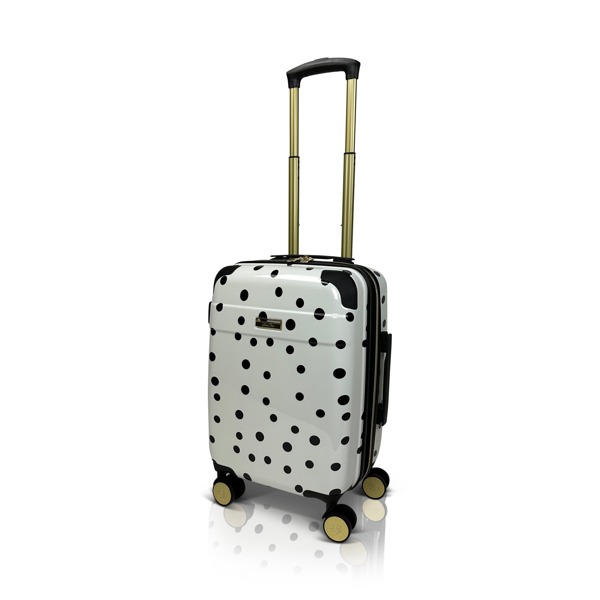White suitcase with black polka dots on a white background