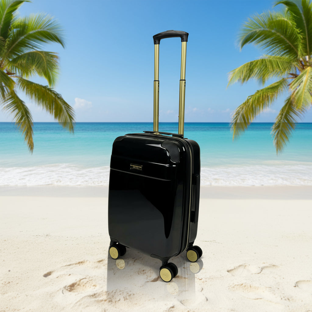 Black suitcase with gold accents on a white background