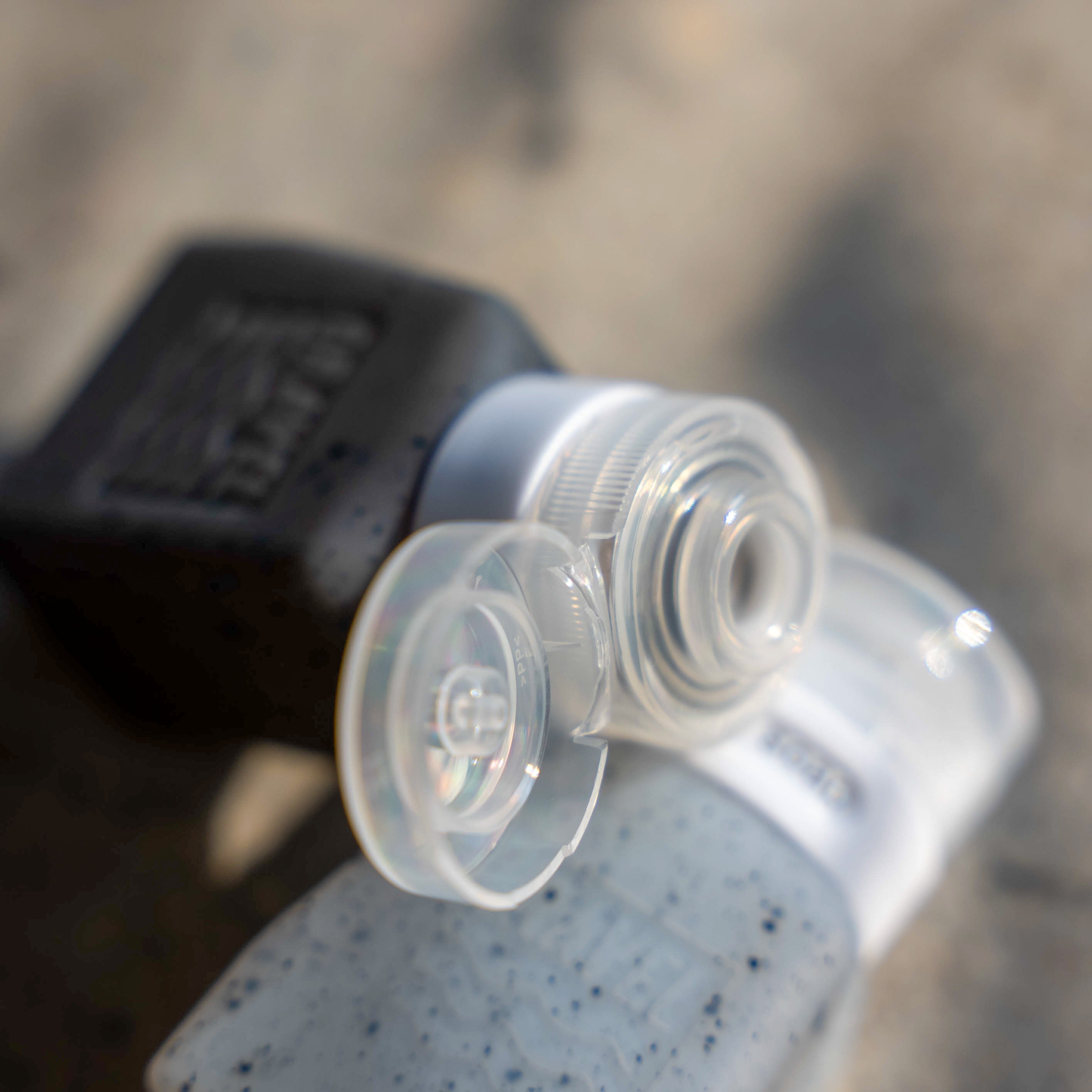Close-up of a water bottle with a cap on a blurred background