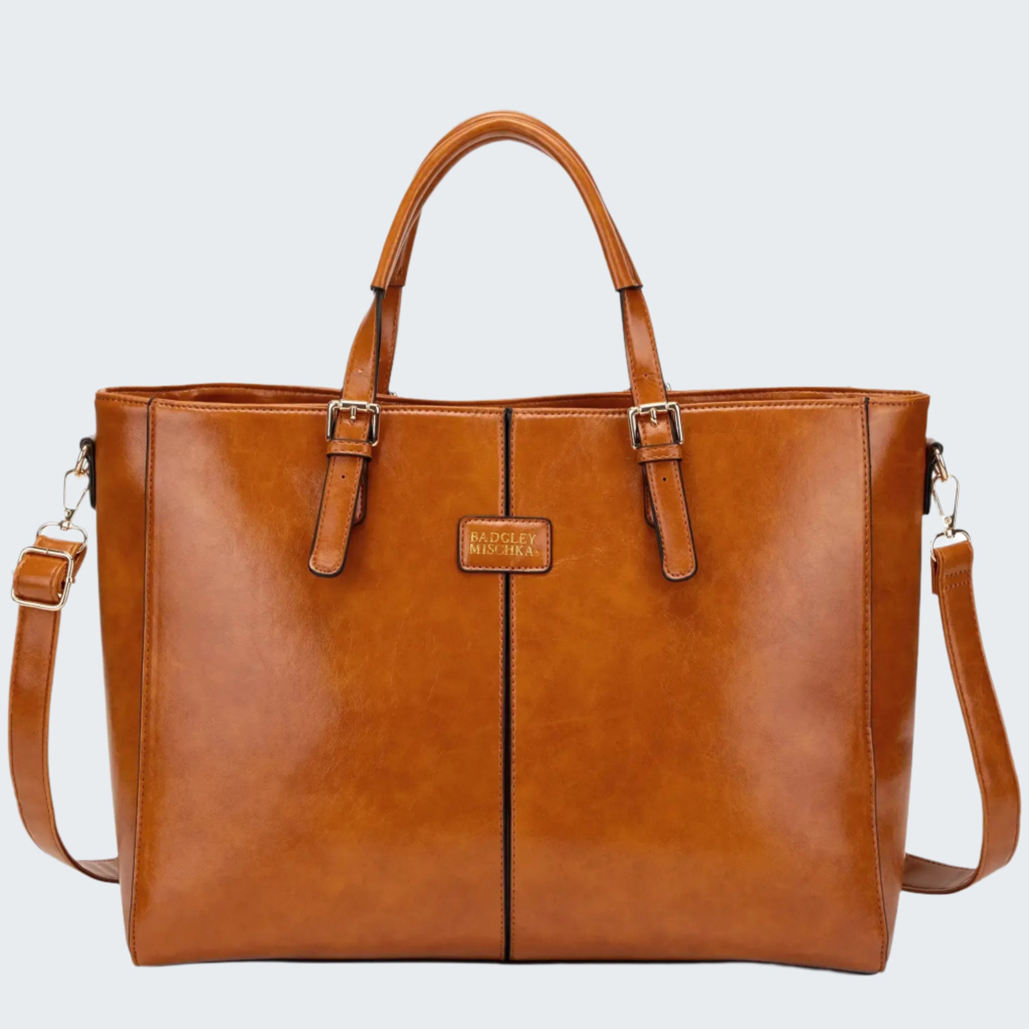 Brown leather tote bag with a visible brand logo on a white background