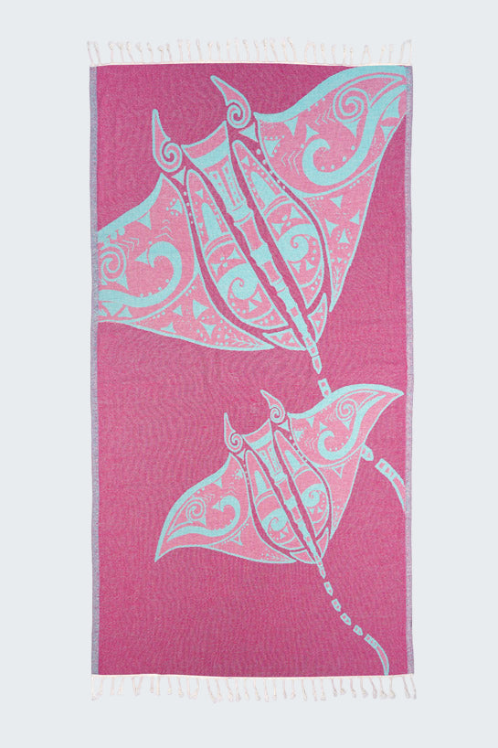 Towel with stingray design on a pink background