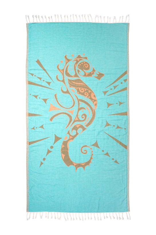 Towel with a seahorse design on a blue background