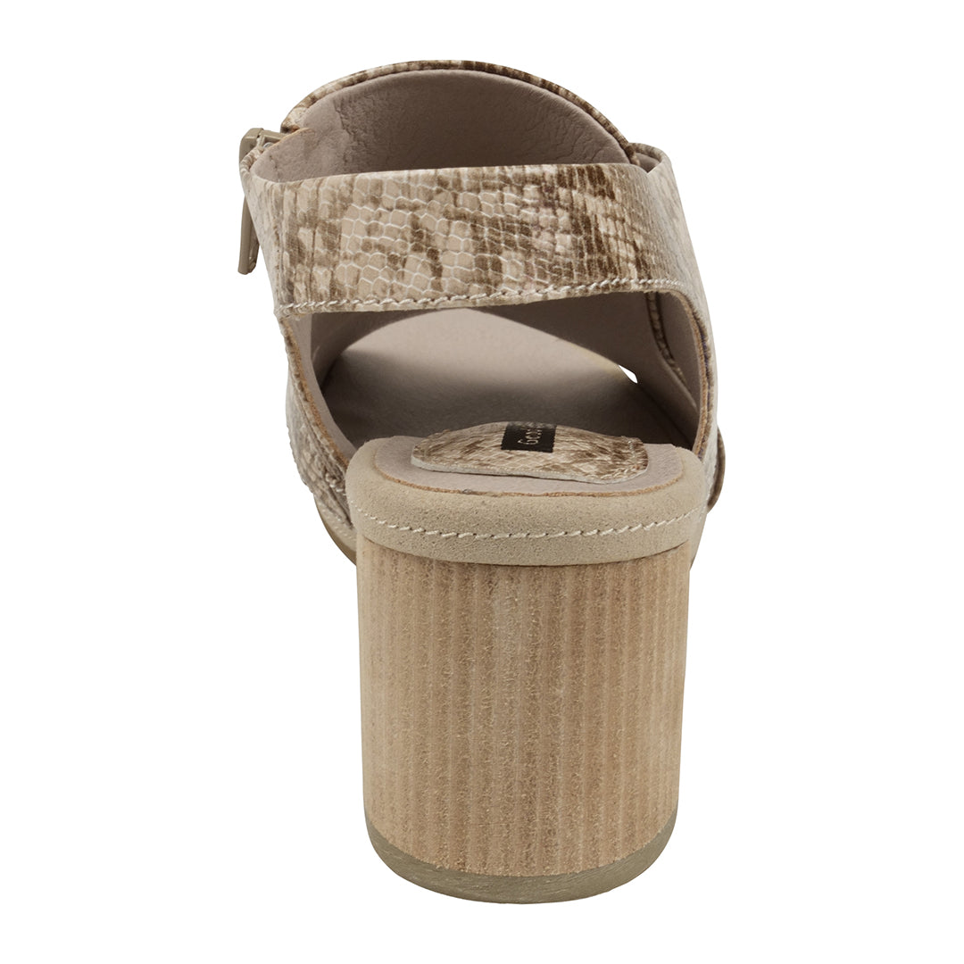 Beige sandal with textured strap and platform sole on a white background
