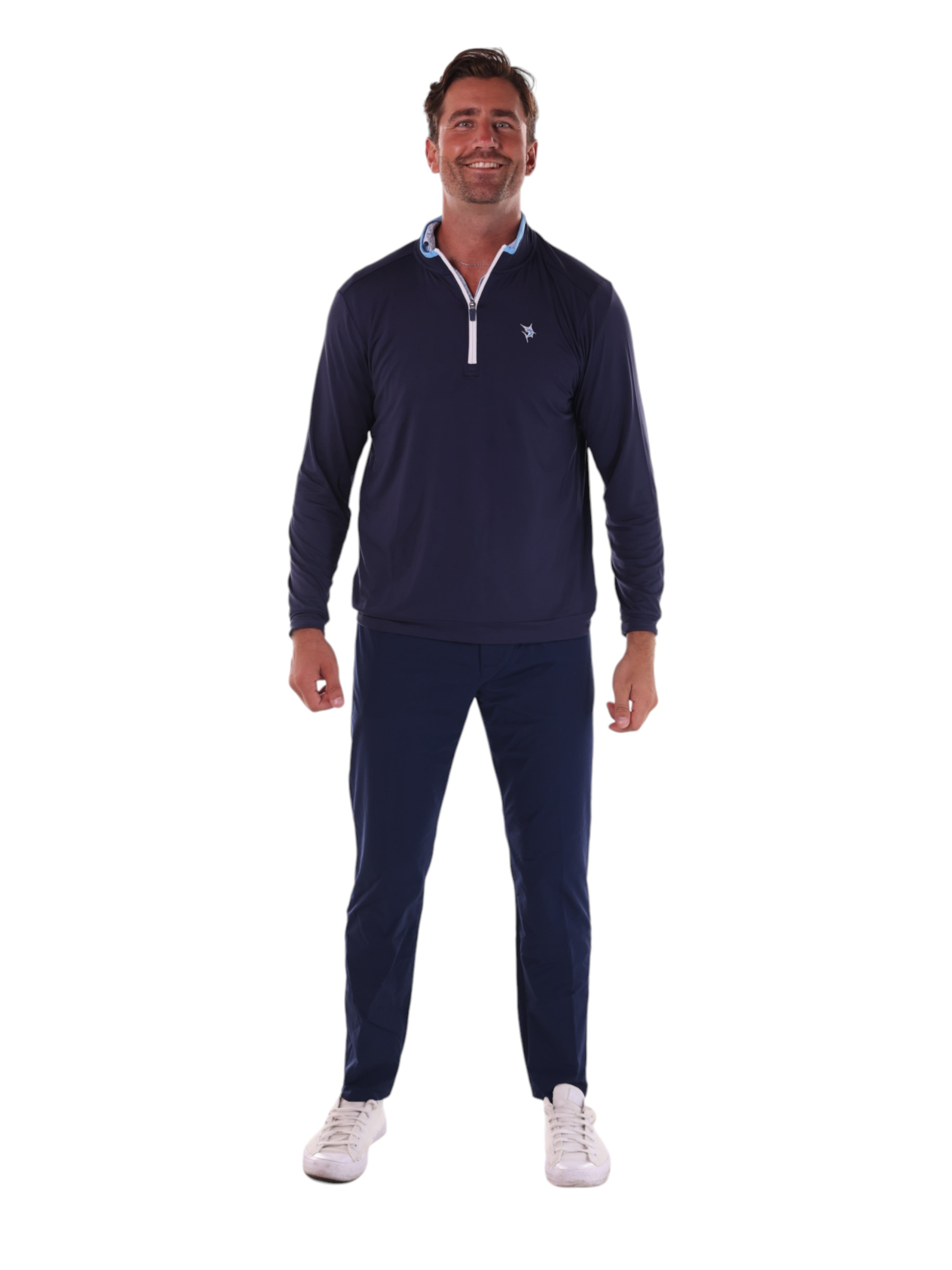 Man wearing a navy long-sleeve shirt and pants with a logo on a white background