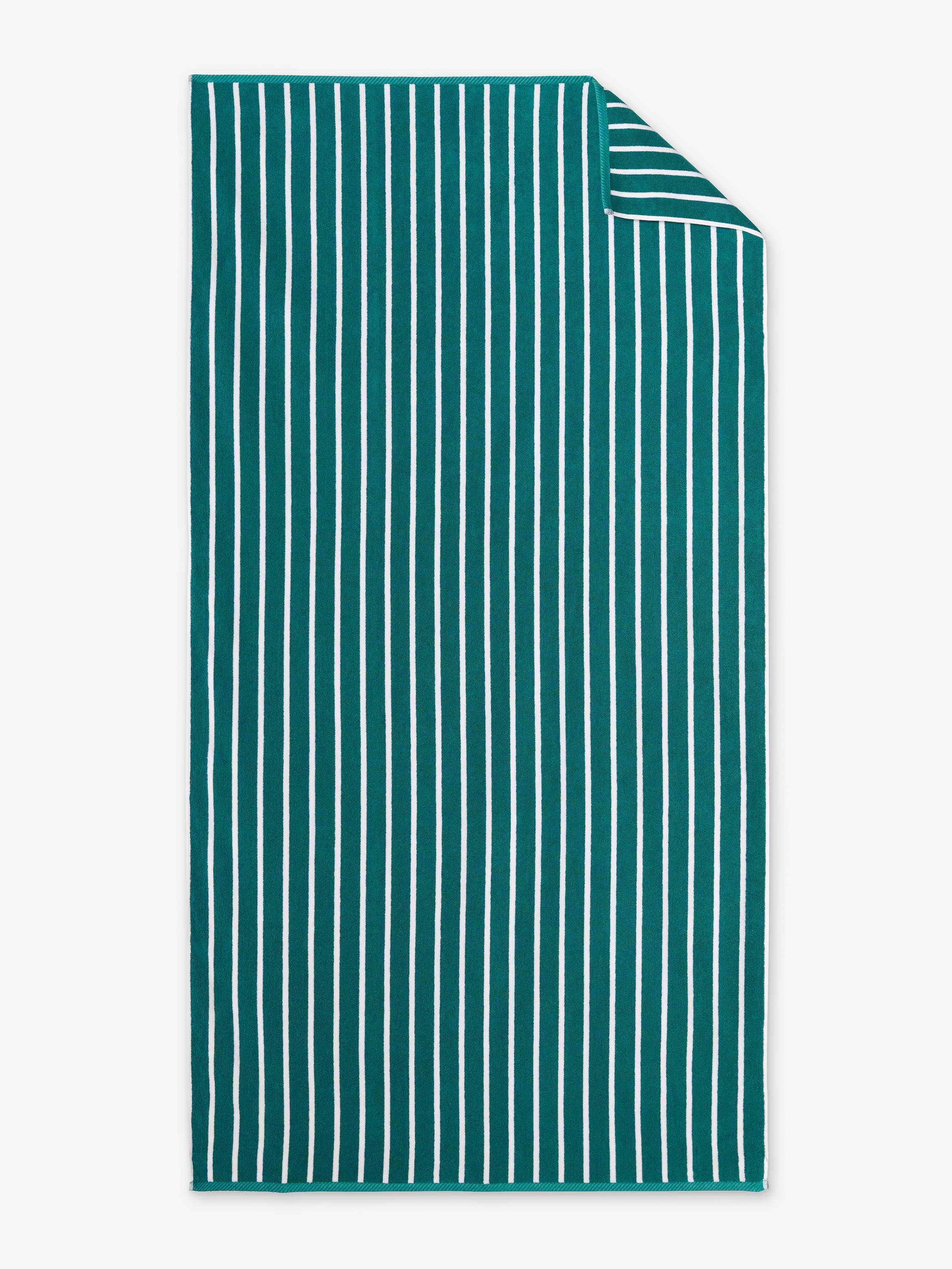 Teal towel with white stripes on a white background