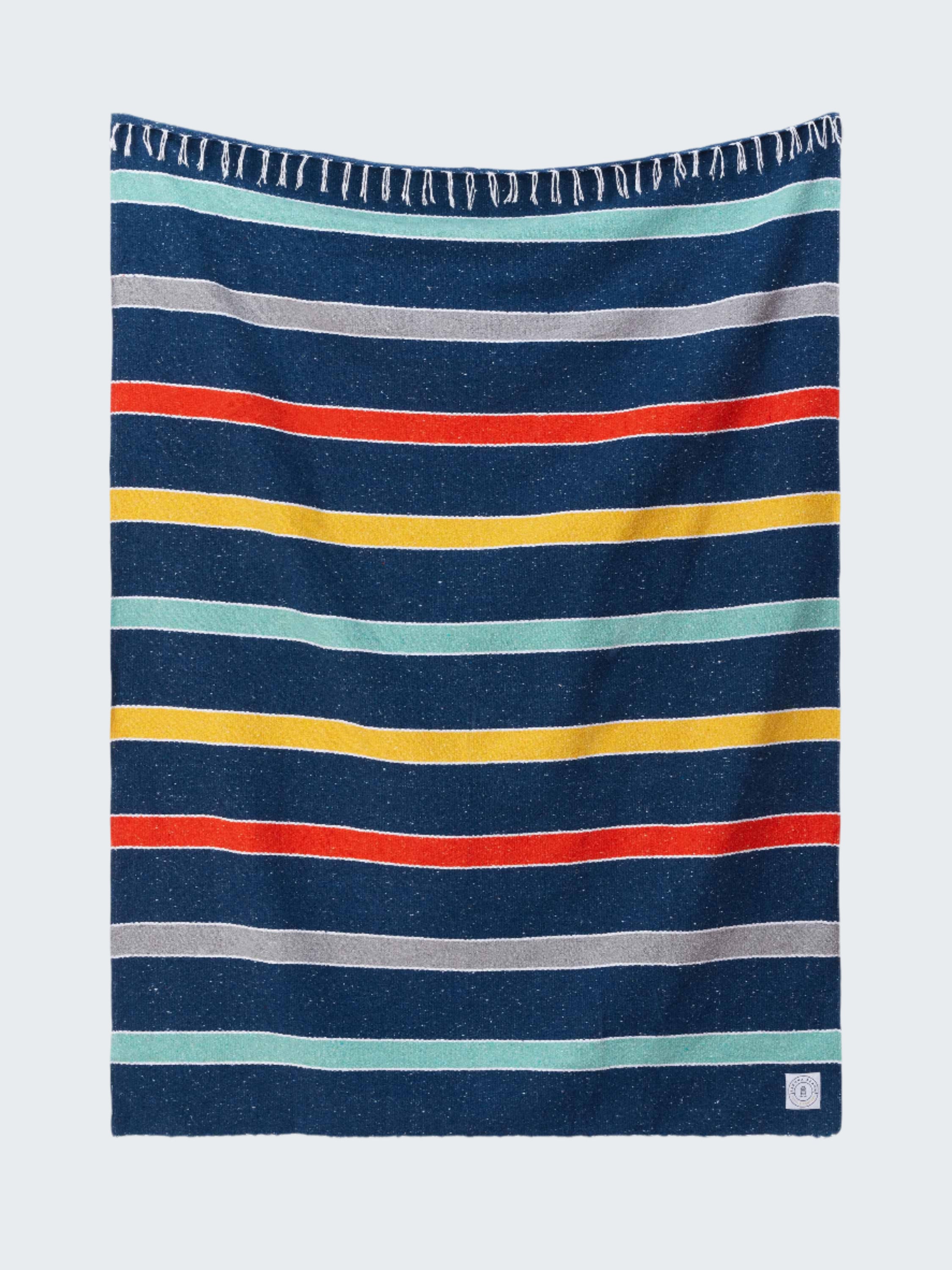 Striped towel with blue, red, yellow, and gray stripes on a white background